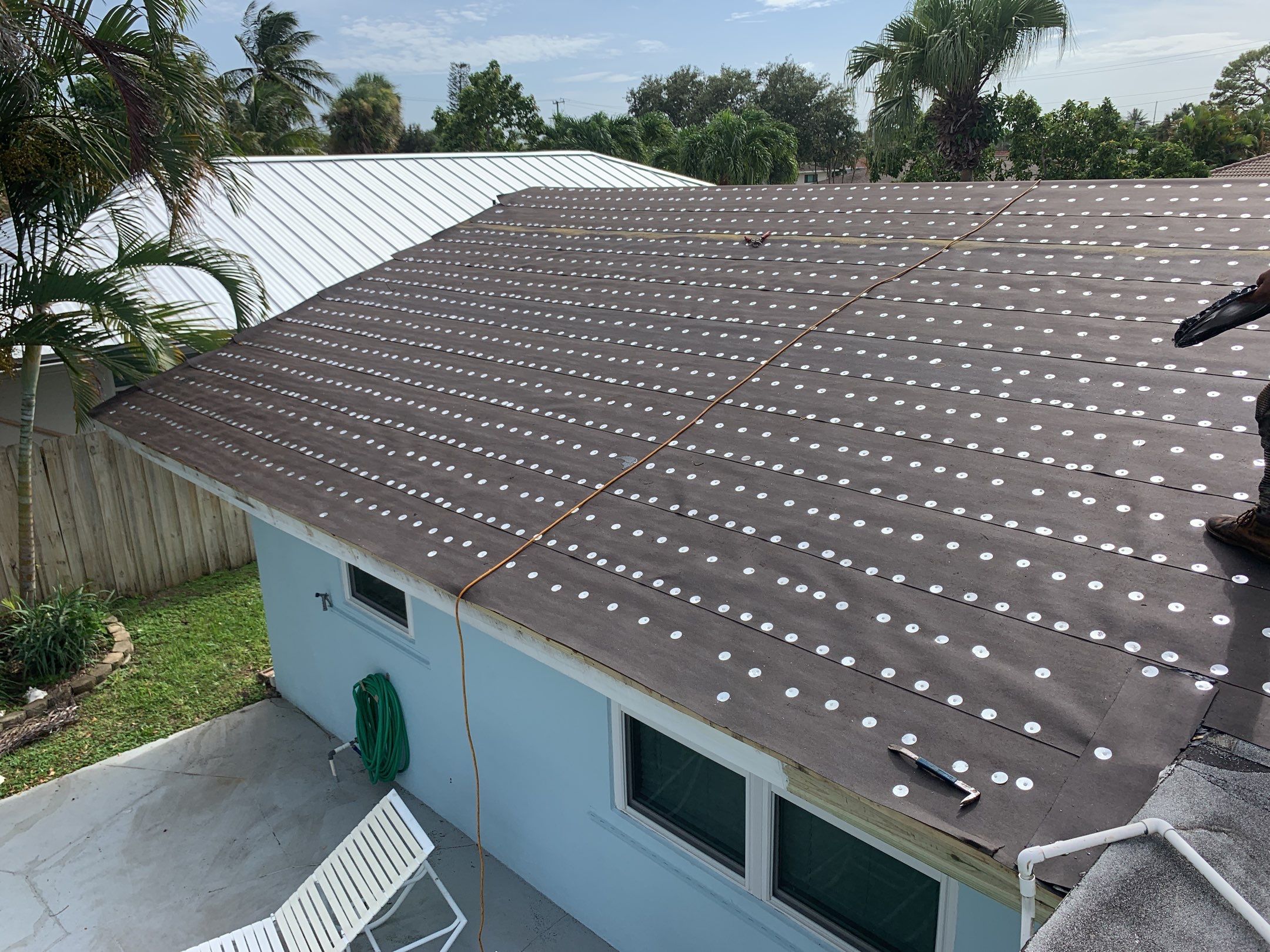 Residential Roofing Installation using 1" Nail strip metal roof by BLUES BROTHERS ROOFING