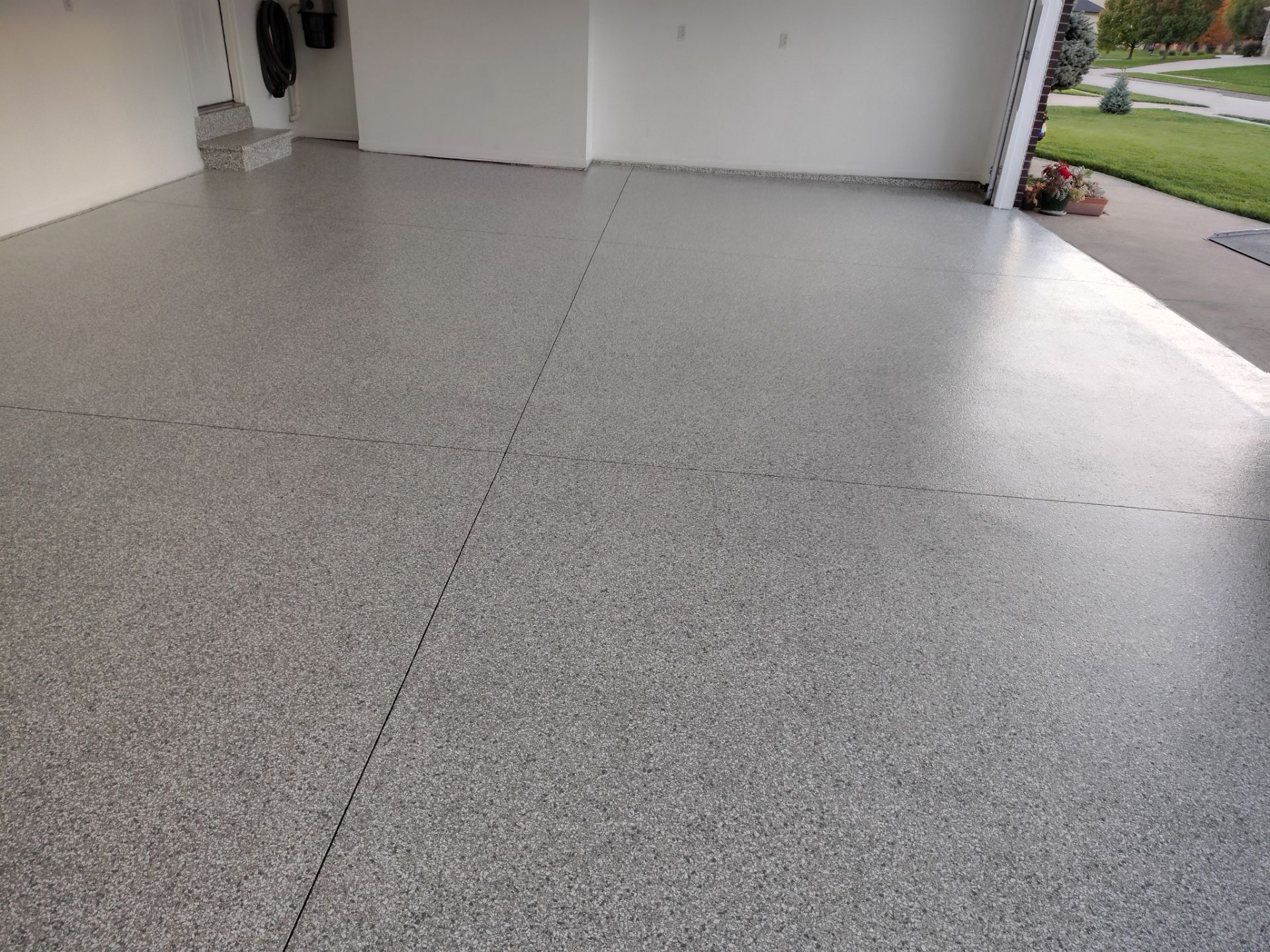 New Johnston Garage Resurfacing by Revival Concrete Coatings, LLC