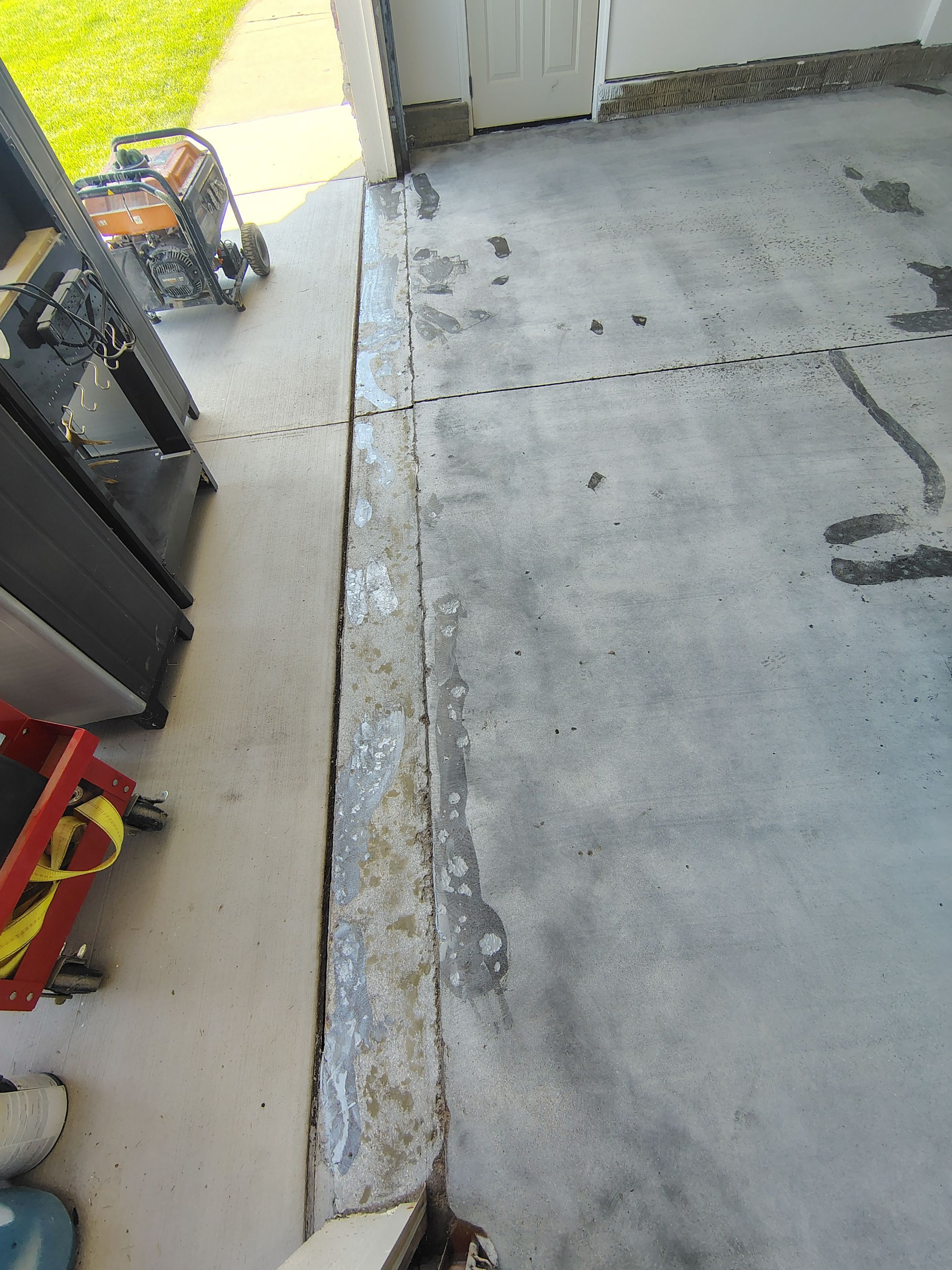 Custom Grey Speckled Epoxy Floor Coating for Sioux Falls Garage by Select Painting, Coatings & Garage Cabinets
