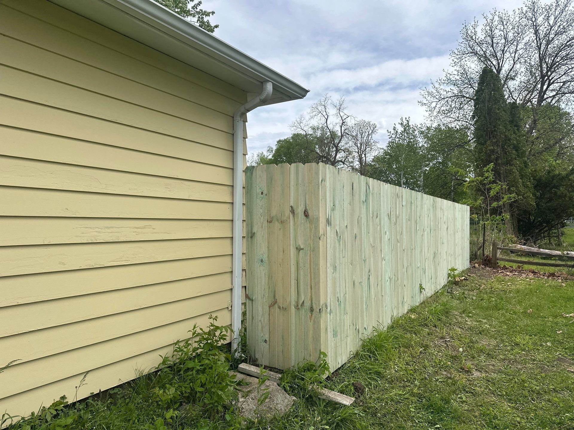 Pressure-Treated Wood Privacy Fence Installation in Waterloo by Perfect Picket Fence and Stain