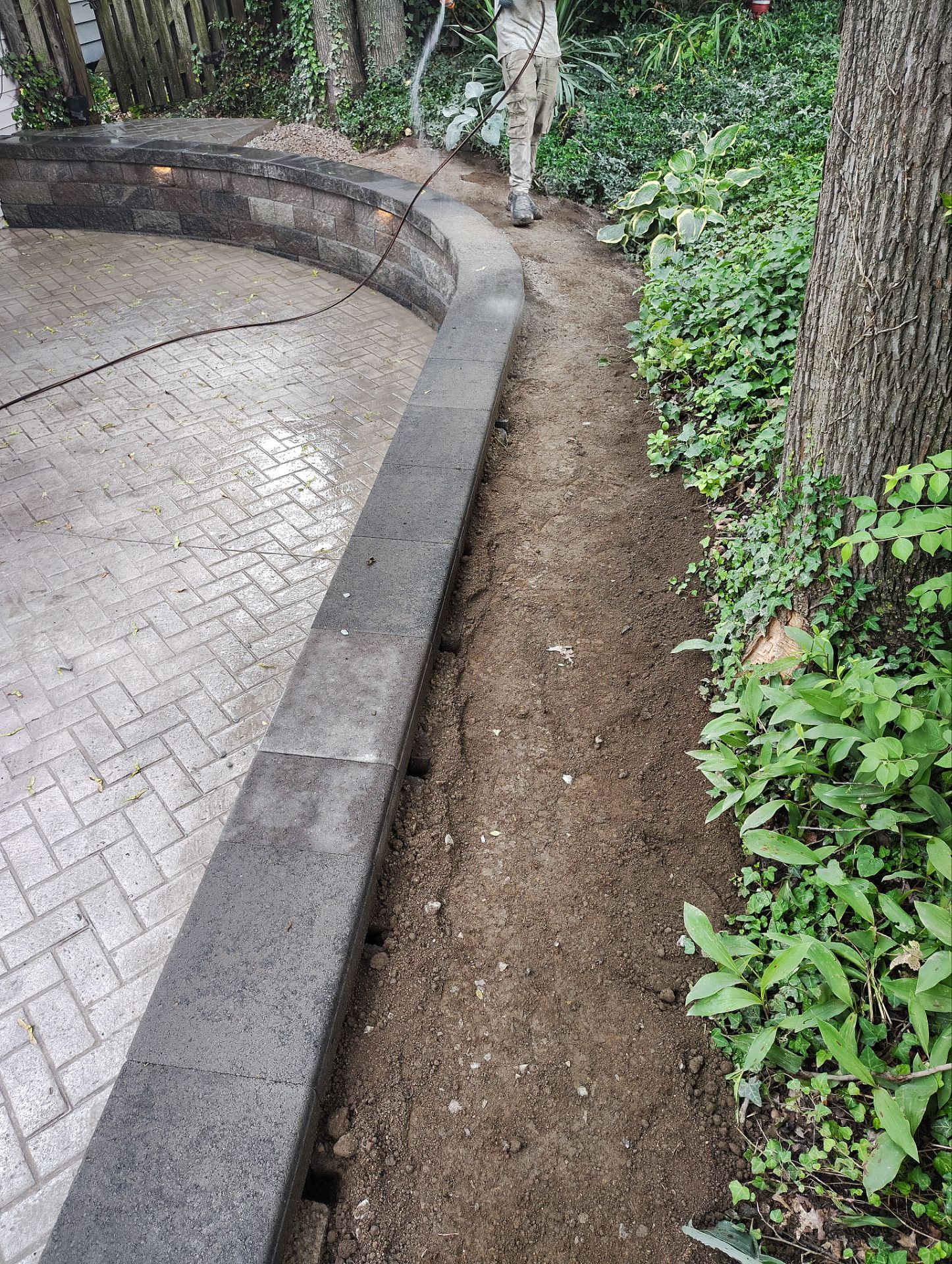 Stamped Concrete and Retaining Wall by Cousins Roofing Siding & Decks