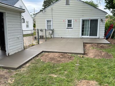 Broom finished patio and garage floor replacement