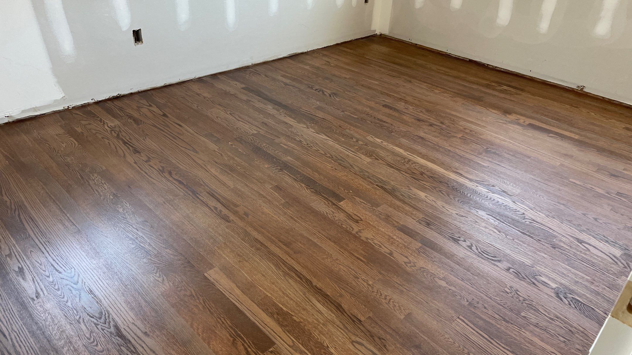 Remodeled Home with new tile floors, Showers and Refinished Oak Floors with stain and Waterbased Finish by Footprints Floors of Coastal Carolina