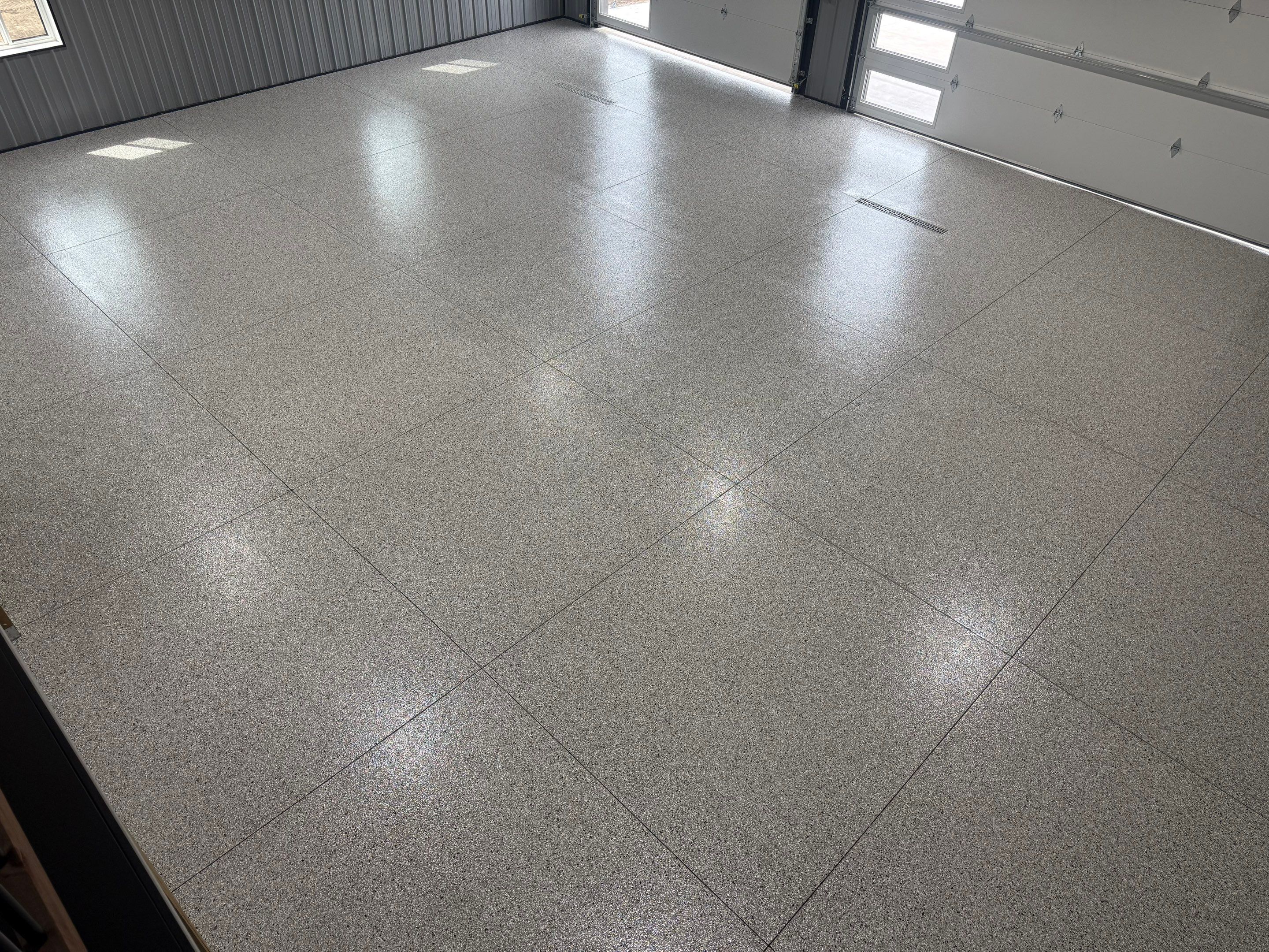 Polyaspartic Garage Floor Coating with Decorative Flake in Wentworth by Select Painting, Coatings & Garage Cabinets