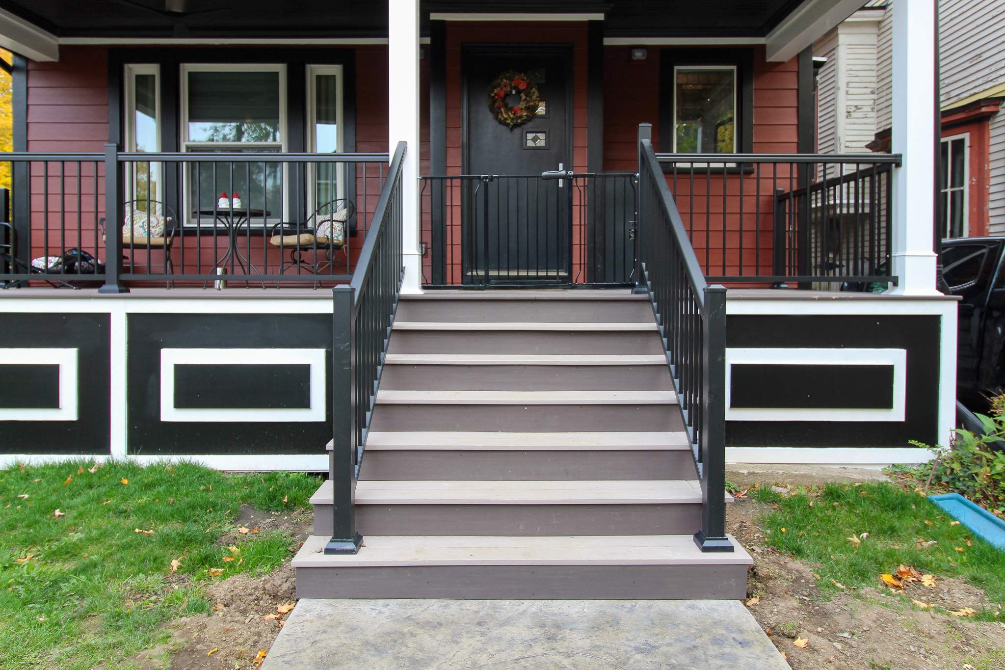Exterior Renovations- Siding, Stamped Concrete, Porch, and Railings by Ivy Lea Construction