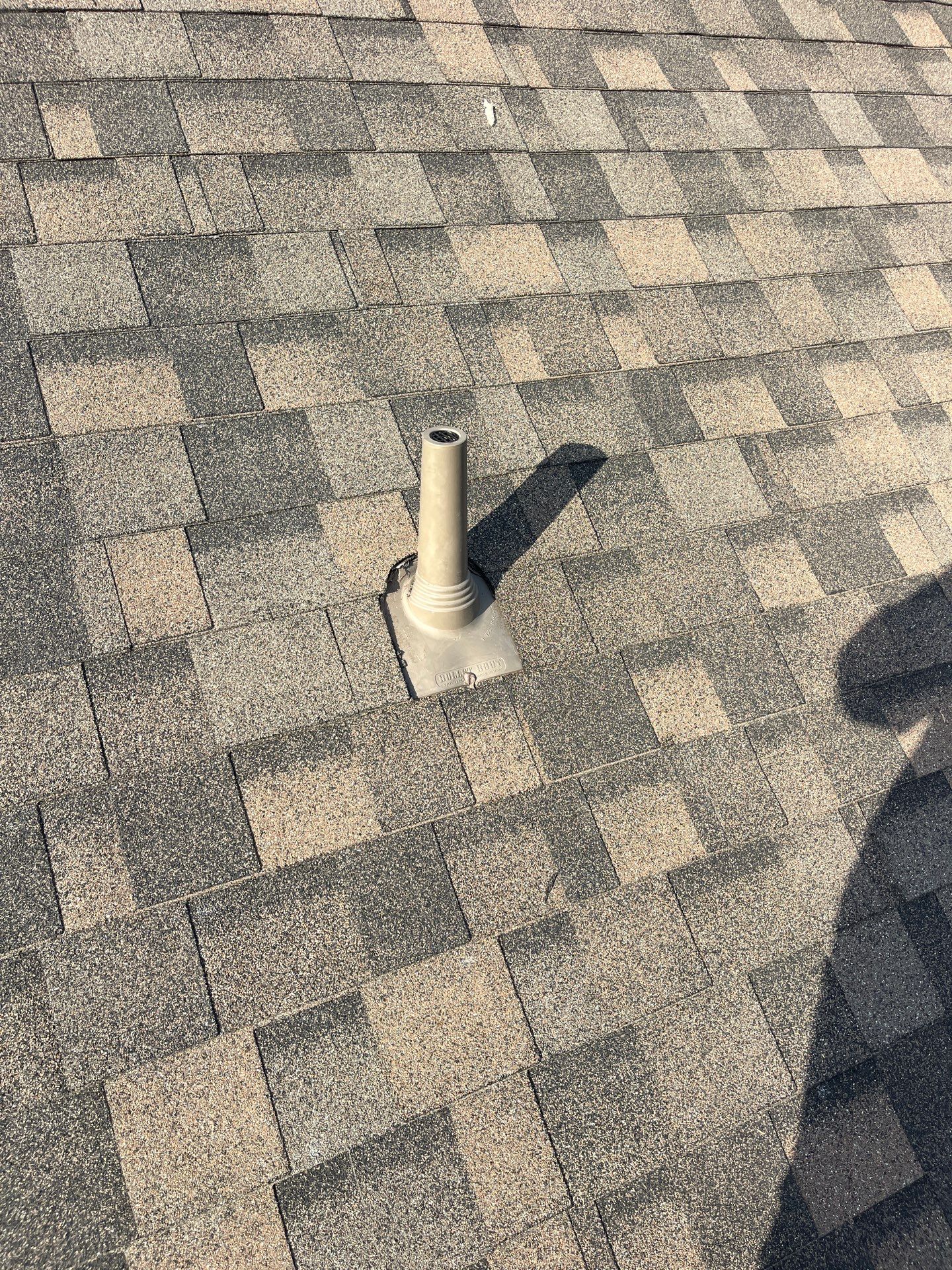 Tan exterior with IKO Driftshake by Tejas Roofworks + Restoration