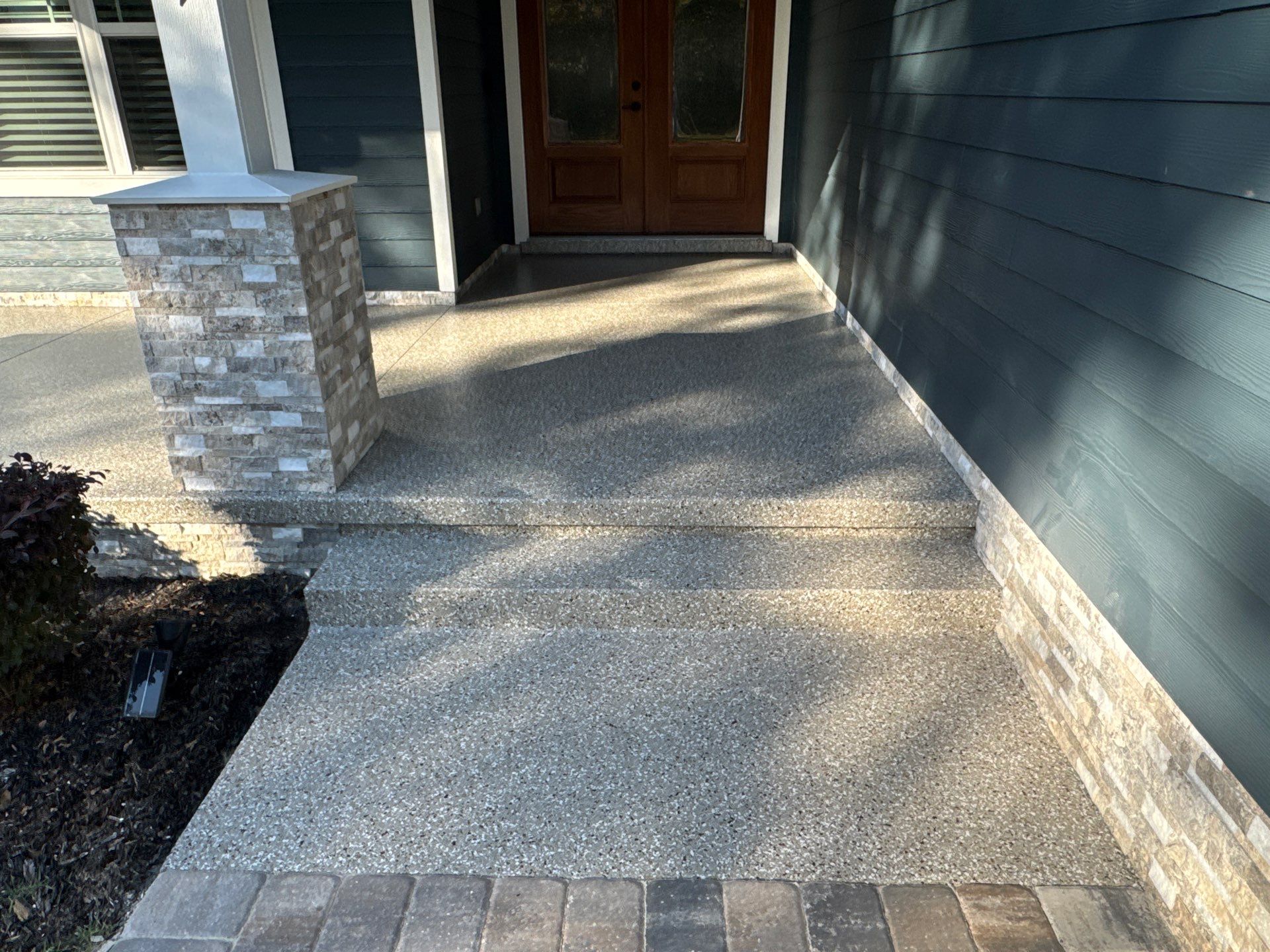 Front and Back Porches in Chiefland, FL in Pebble Beach by Cross Creek Concrete Coatings