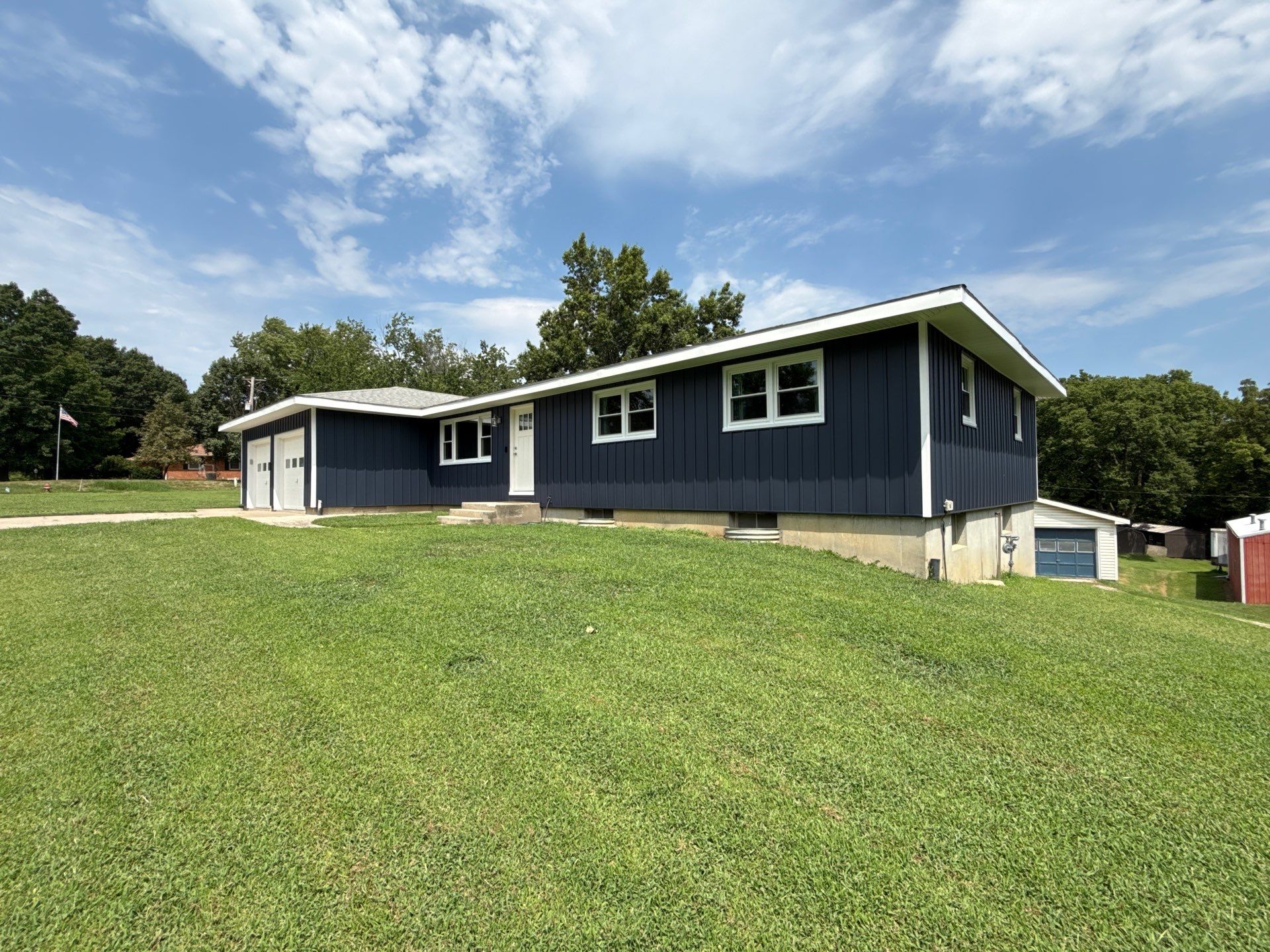 Indigo Board and Batten Siding and Window Replacement in Smithville by EEC Windows, Siding & Roofing