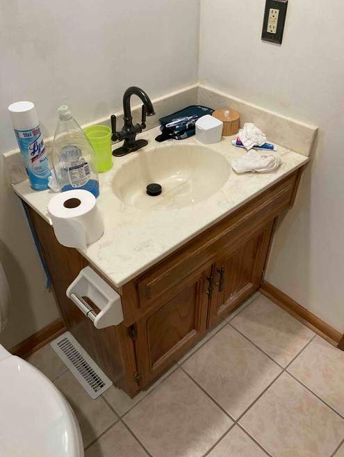 Bathtub, door, toilet, flooring, and countertop by The Shower Company