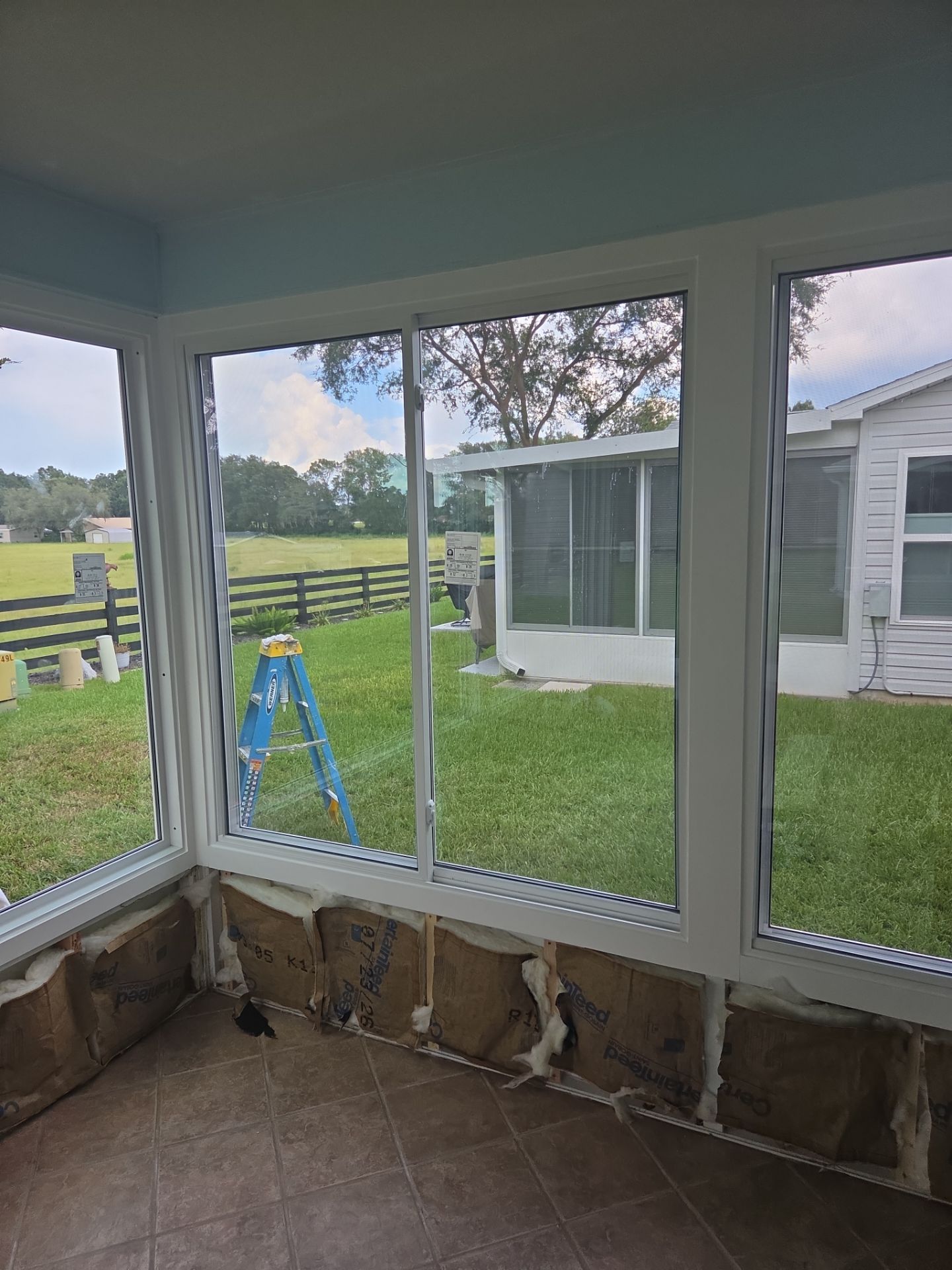 Sunroom Conversion with Alside Windows and Provia Door in The Villages by Windows & Doors Store