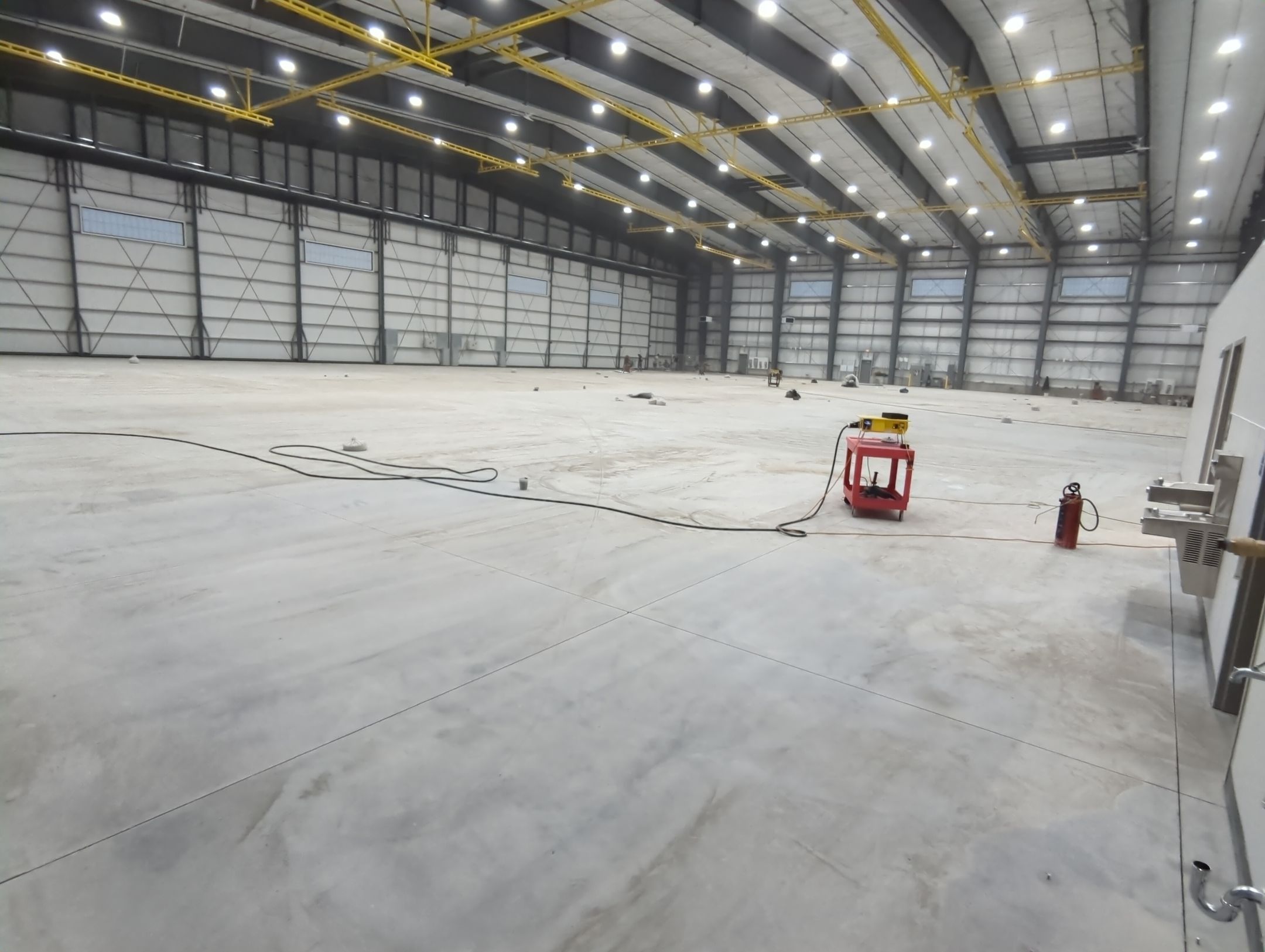 Airplane Hanger using Light Grey Commercial Penntek Epoxy by Croc Coatings, LLC