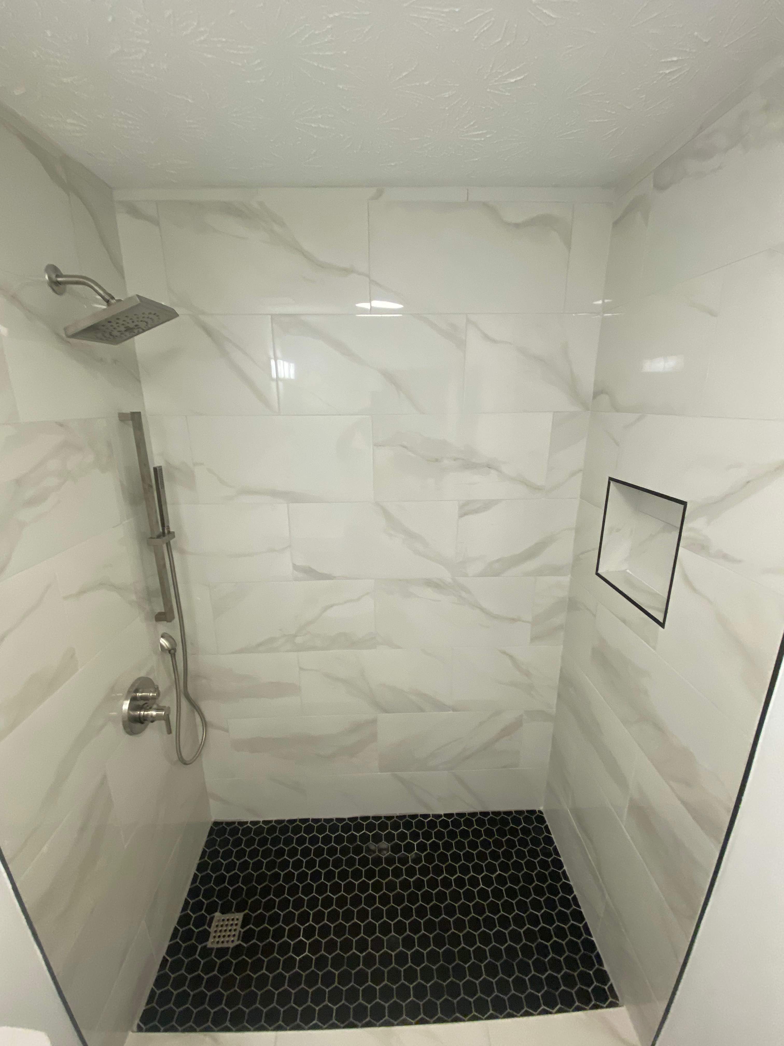 Tub to walk-in shower conversion by Prudencio