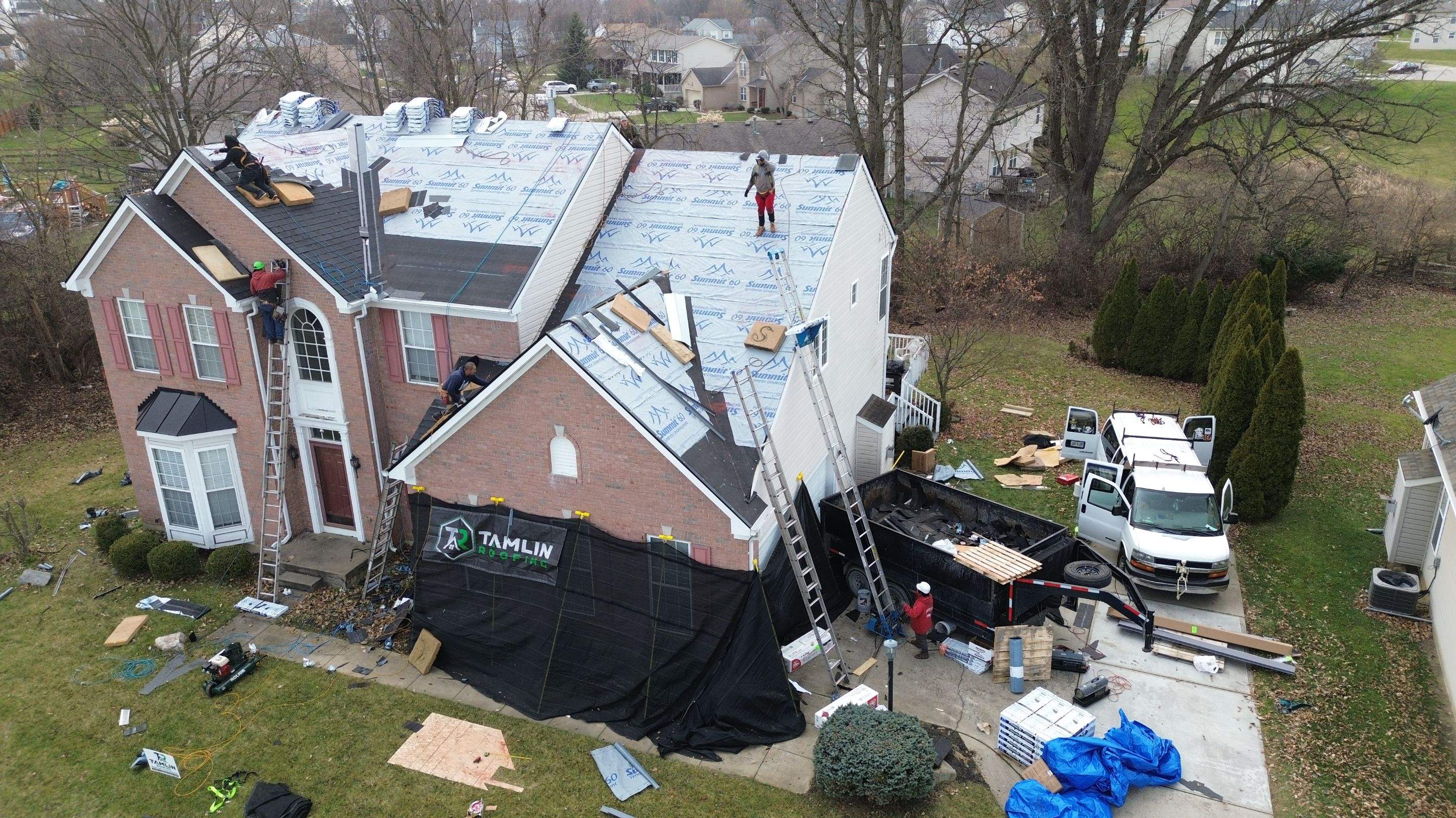 Walden Ponds - Pristine Black and Hydro Flo Gutter Guards by Tamlin Roofing