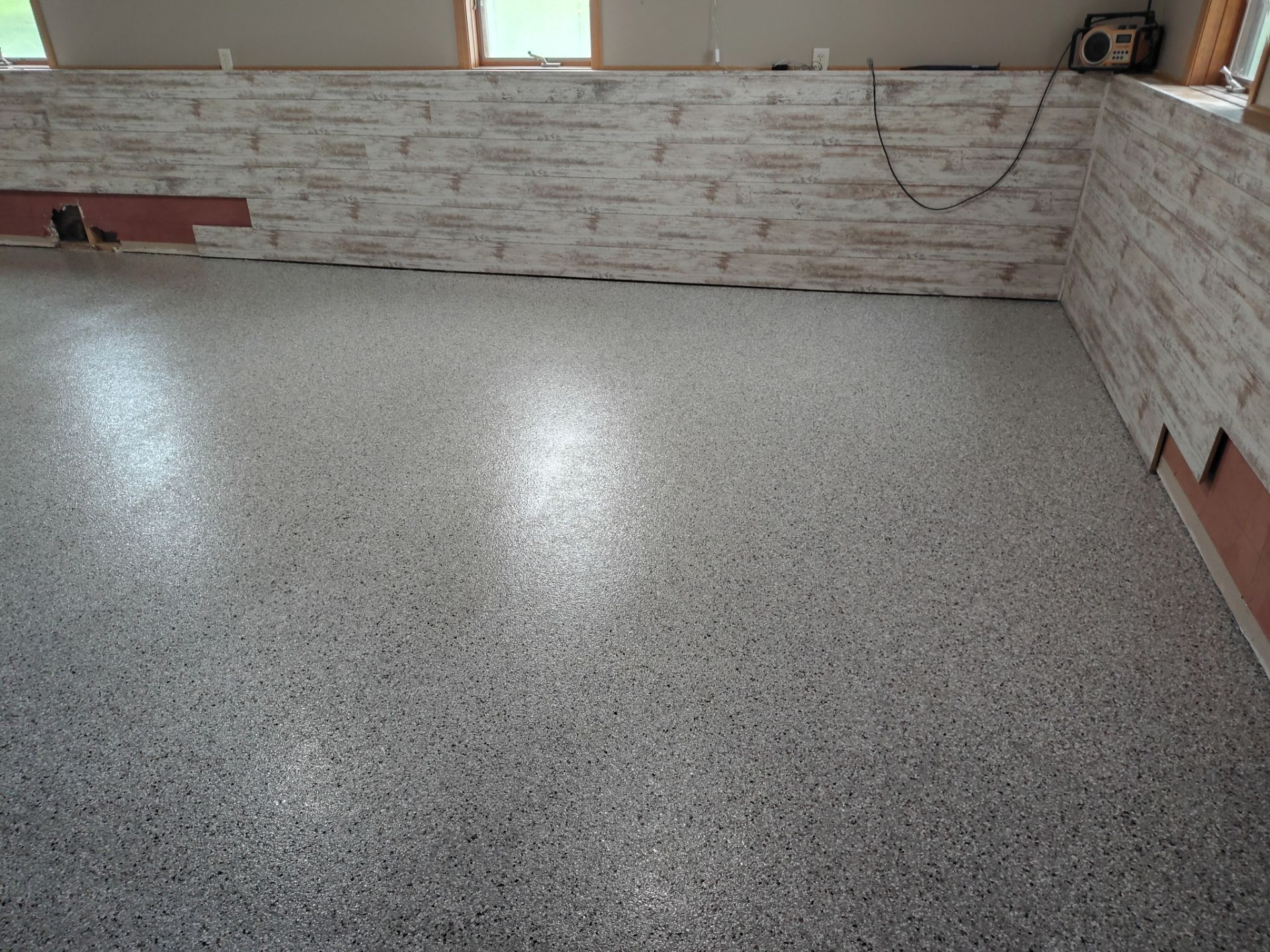 Maxwell, IA Coyote Flake Garage and Basement by Revival Concrete Coatings