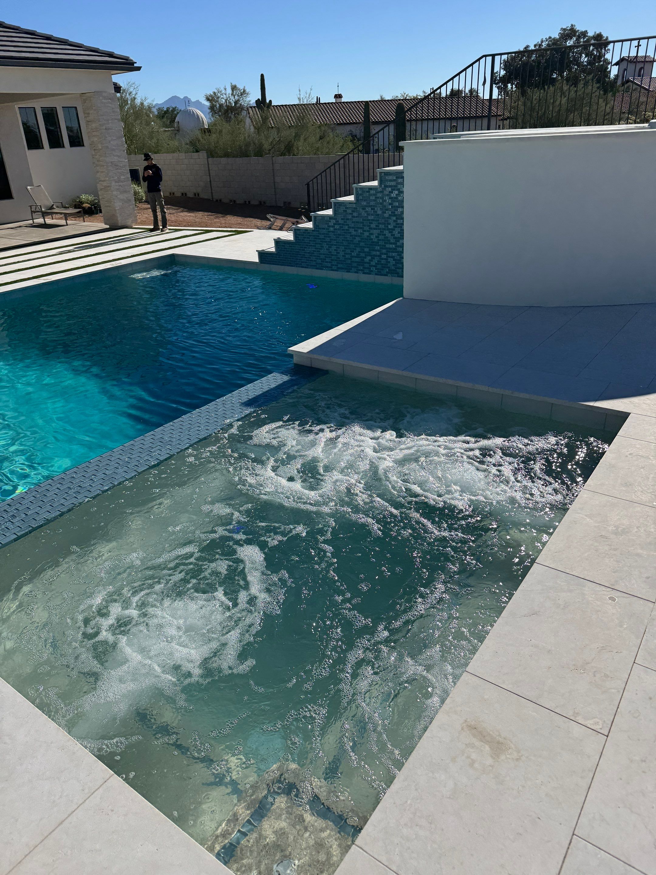 Pool and spa build with slide & outdoor kitchen by Modern Pools
