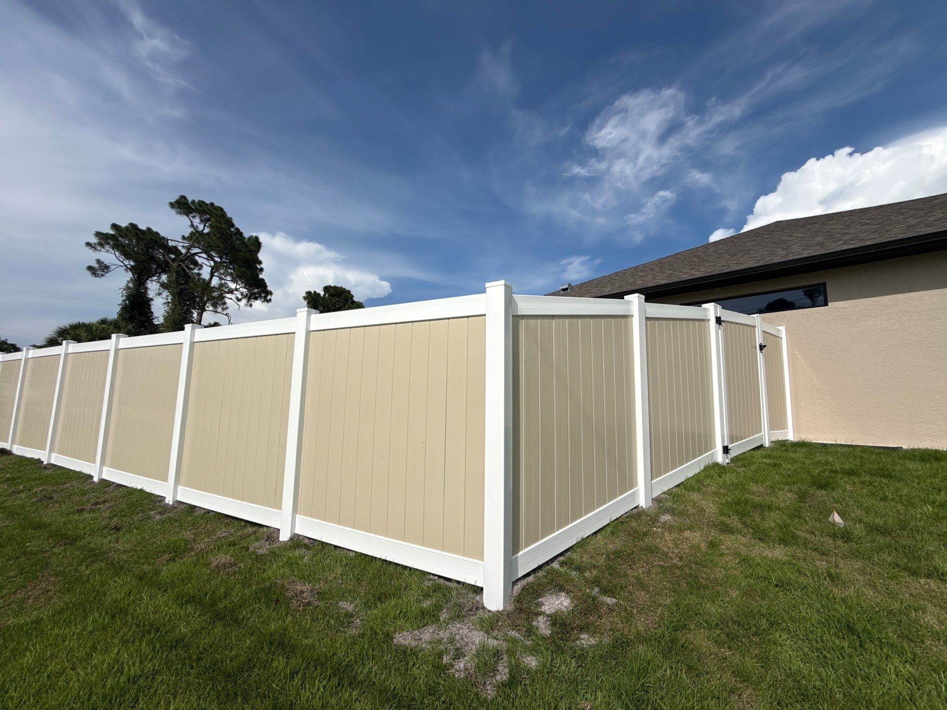 Custom Two-Tone Vinyl Privacy Fence Installation in North Port by True Fence LLC