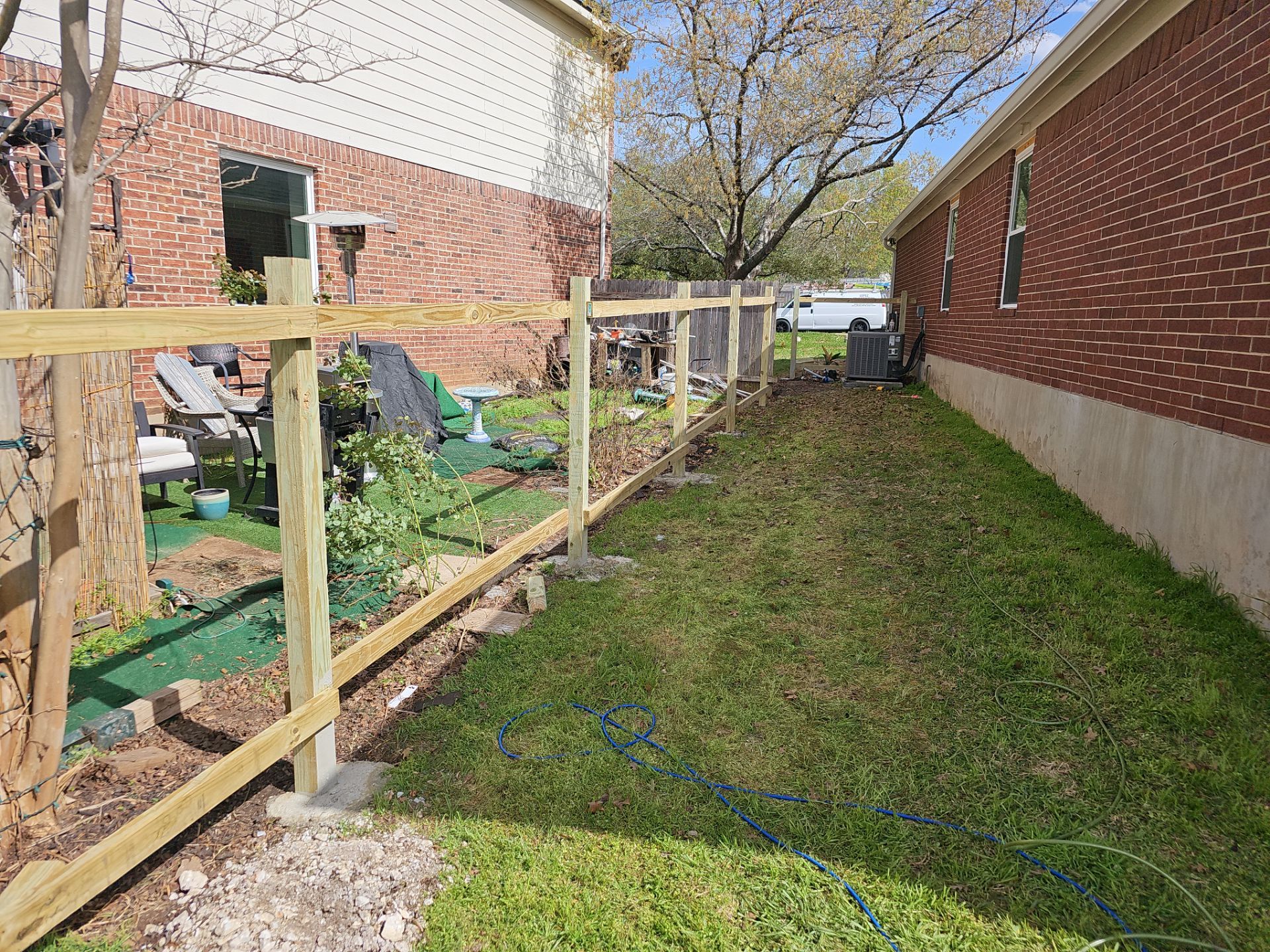 Fence Installation using Cedar Pickets by DeZign Roofing & Exteriors