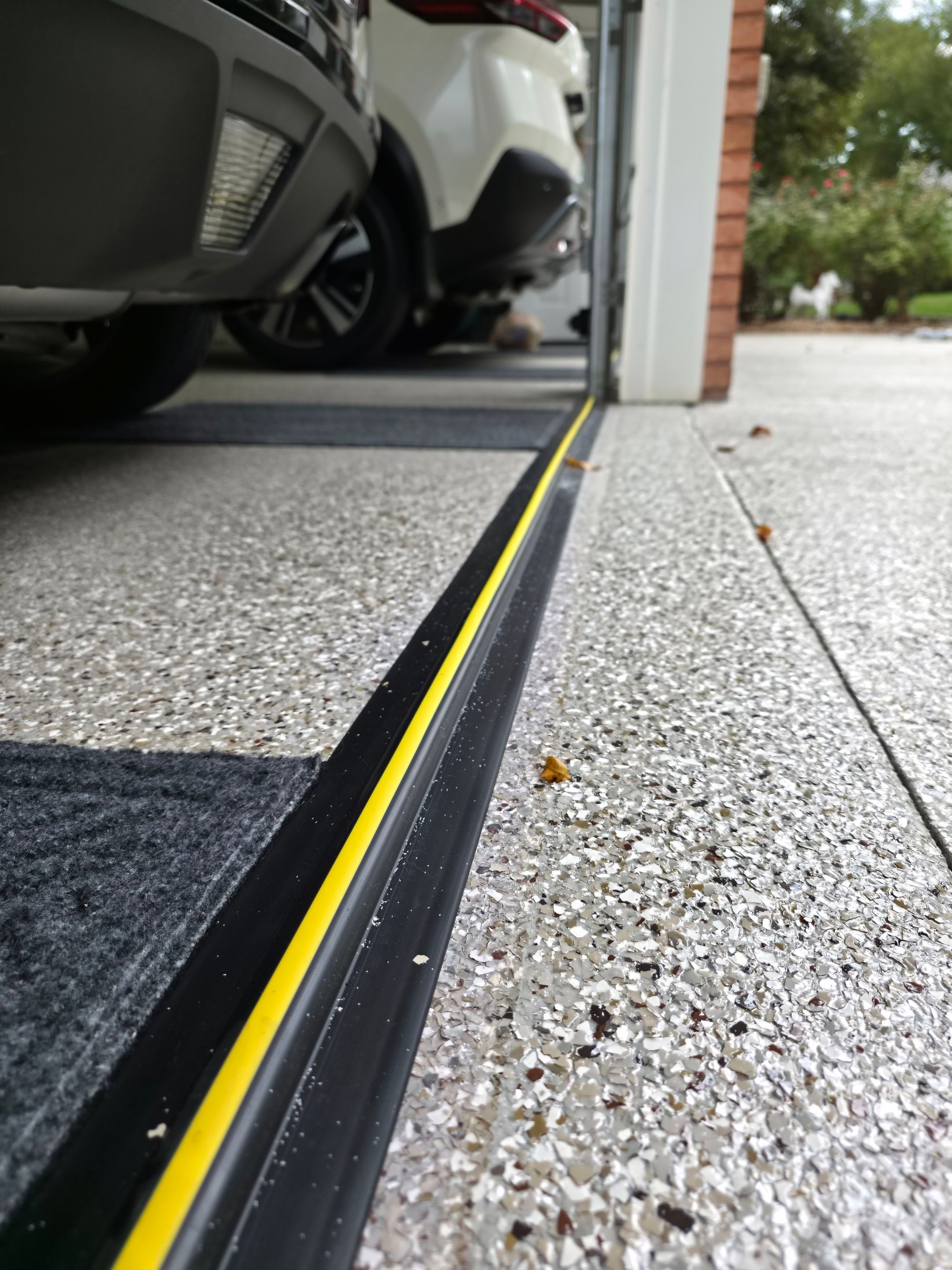 Driveway Using Creekbed and Garnet by Elite Floor Solutions