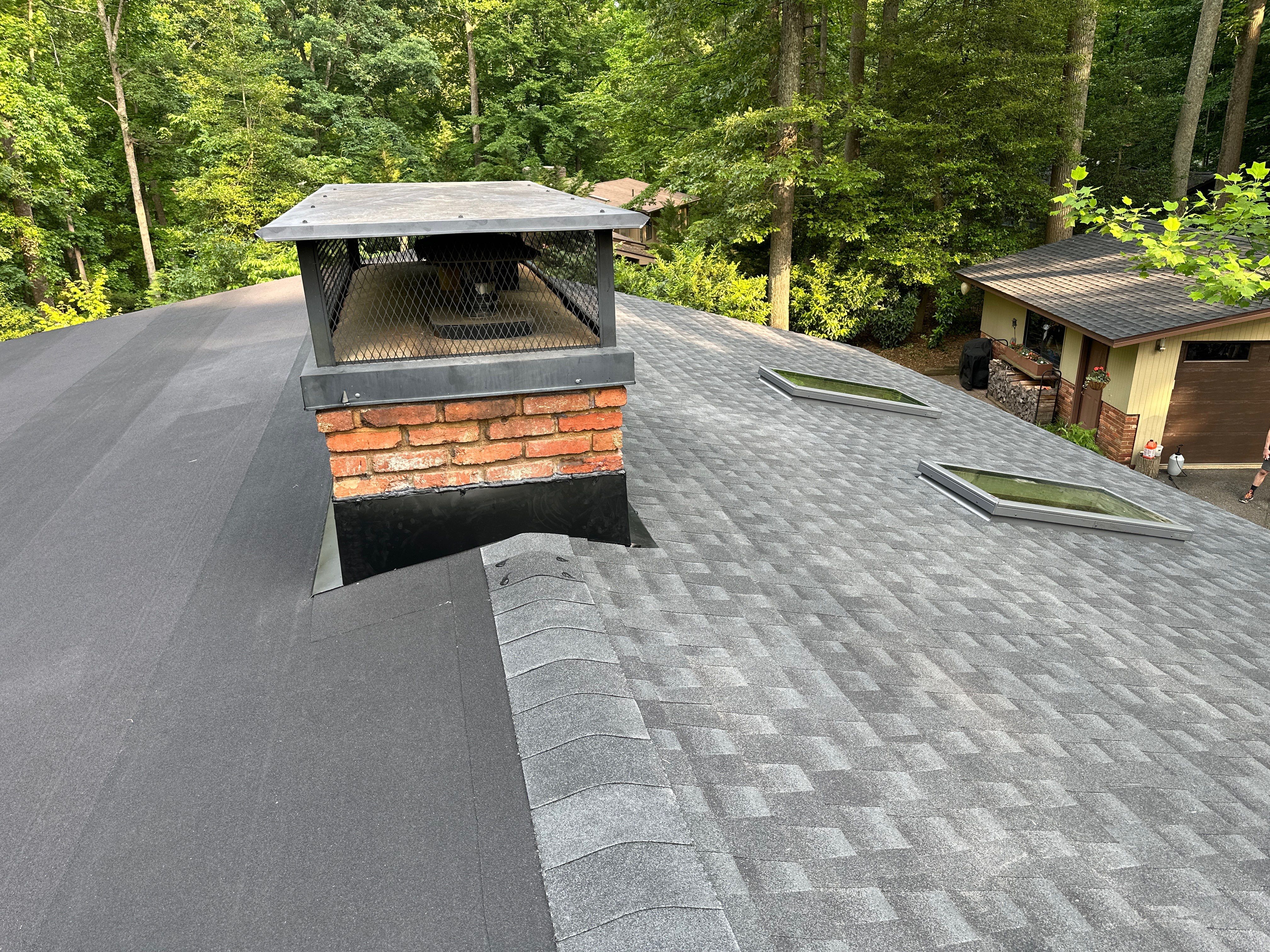 Acorn Deck House Roof Replacement + Skylight Addition by American Home Contractors