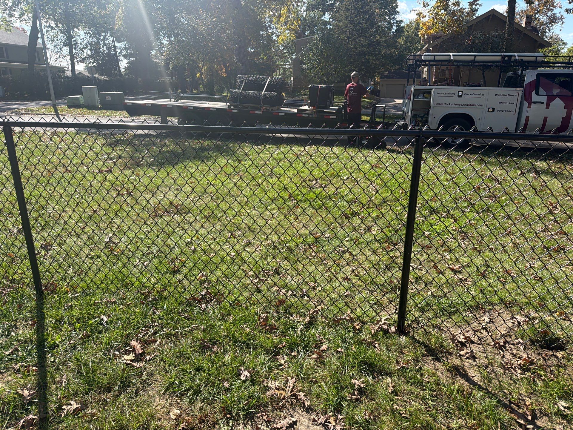 Residential Black Chain Link Fencing in Cedar Falls by Perfect Picket Fence and Stain