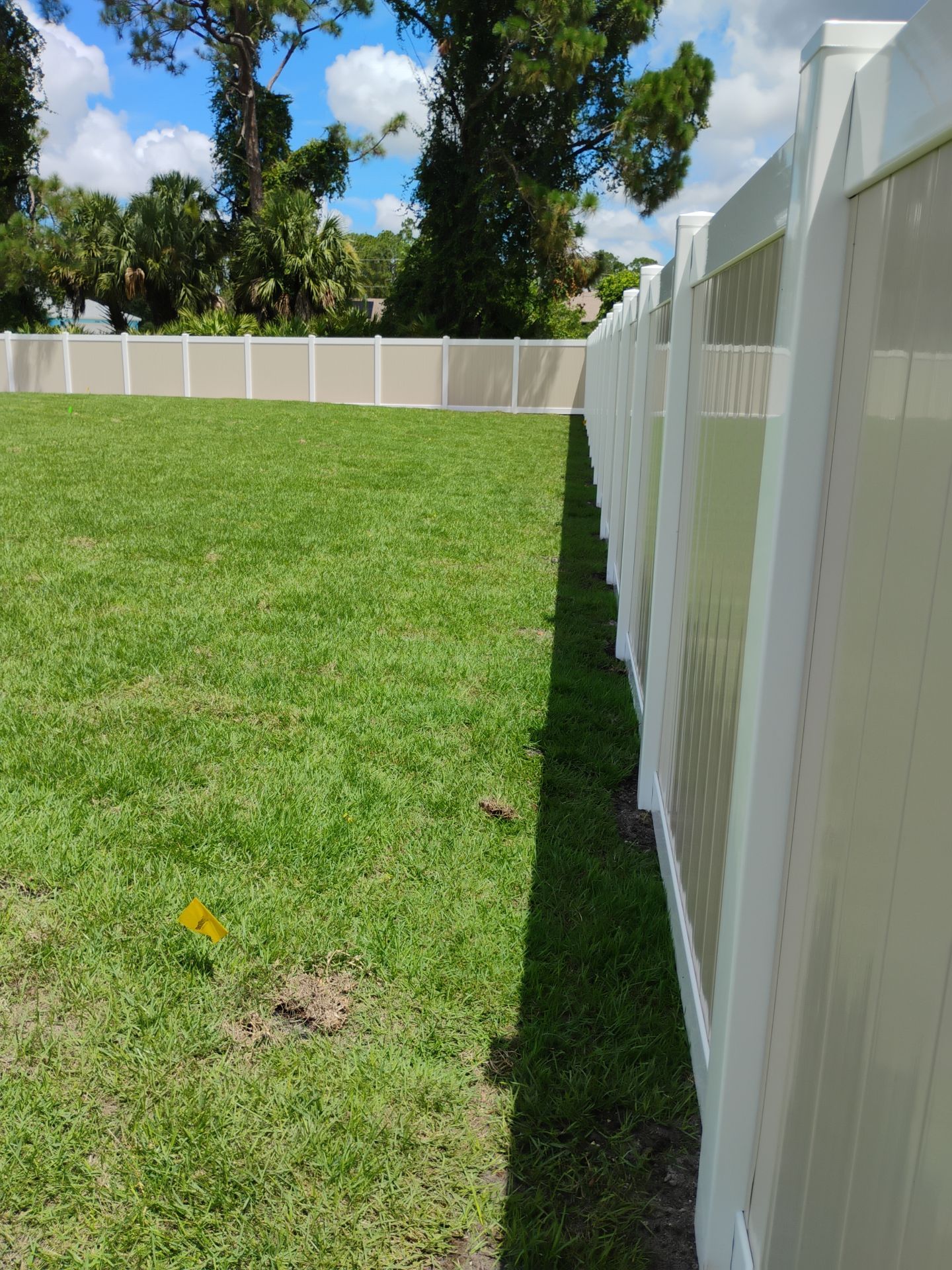 Custom Two-Tone Vinyl Privacy Fence Installation in North Port by True Fence LLC