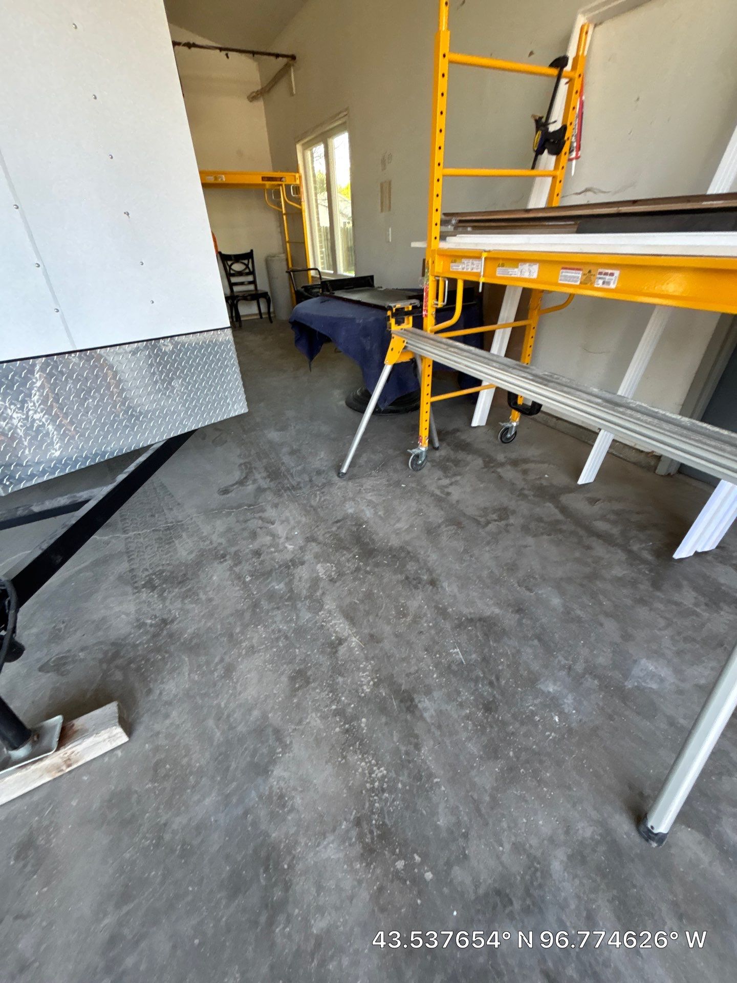 Coyote Flake Concrete Coating for Sioux Falls Garage by Select Painting, Coatings & Garage Cabinets