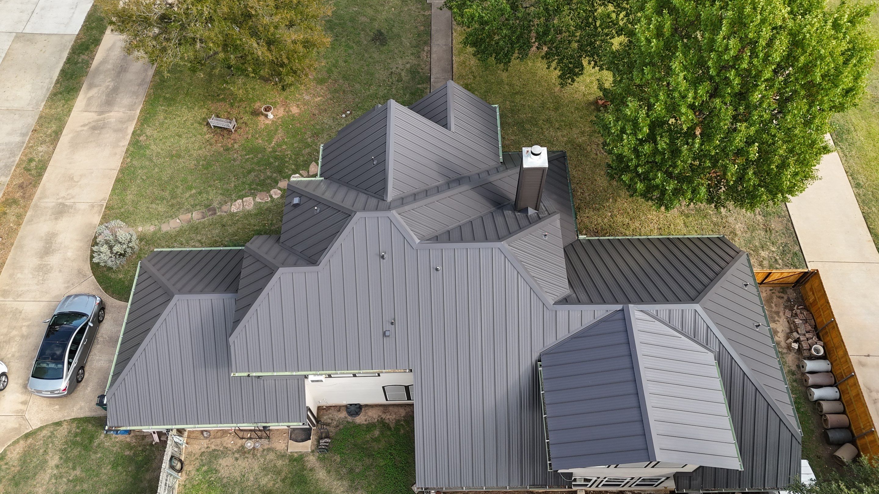 Residential Roof Replacement using 24 GA Double-Lock - Matte Black by Action Exteriors Austin