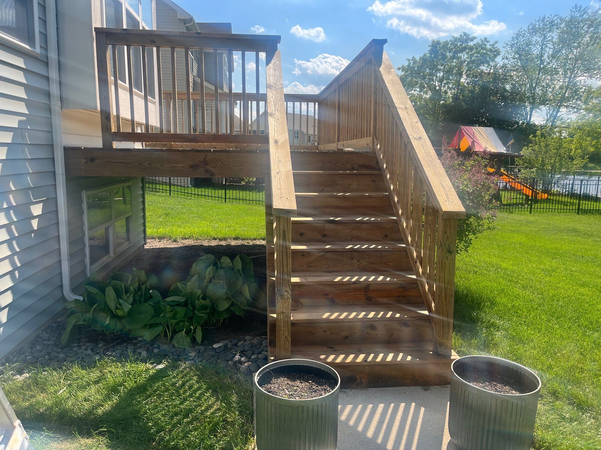 wood deck cleaning and staining by Northern Power Washing LLC.