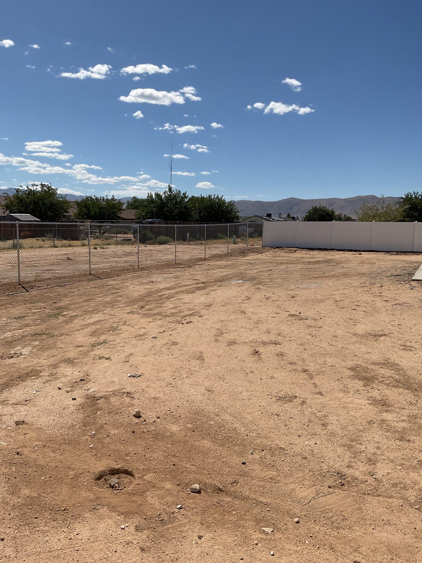 6ft White Privacy Vinyl Fence with Chain-link Fence by Fence Guys Inc.