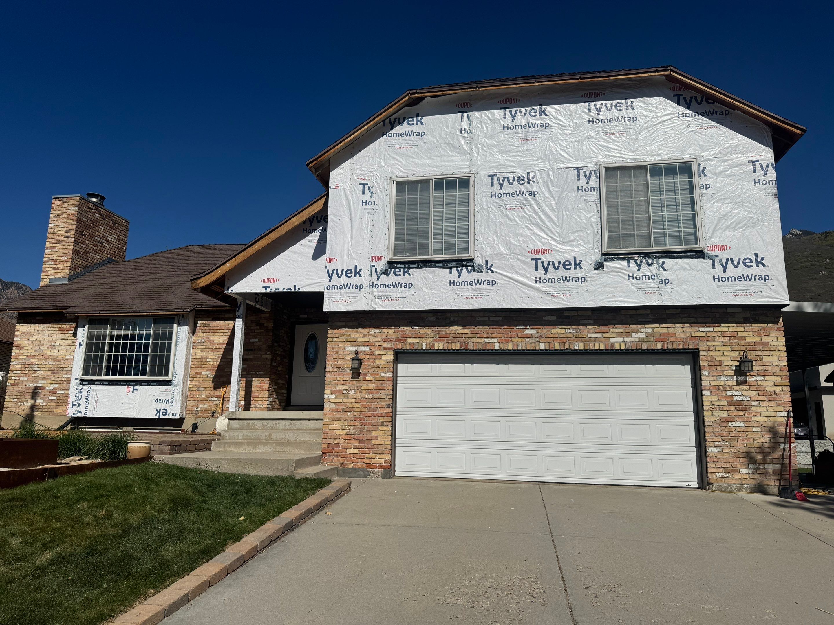 Cottonwood Heights | Custom Hardie Exterior & Bold Fascia | Cobble Stone Accents by Ideal Siding Utah