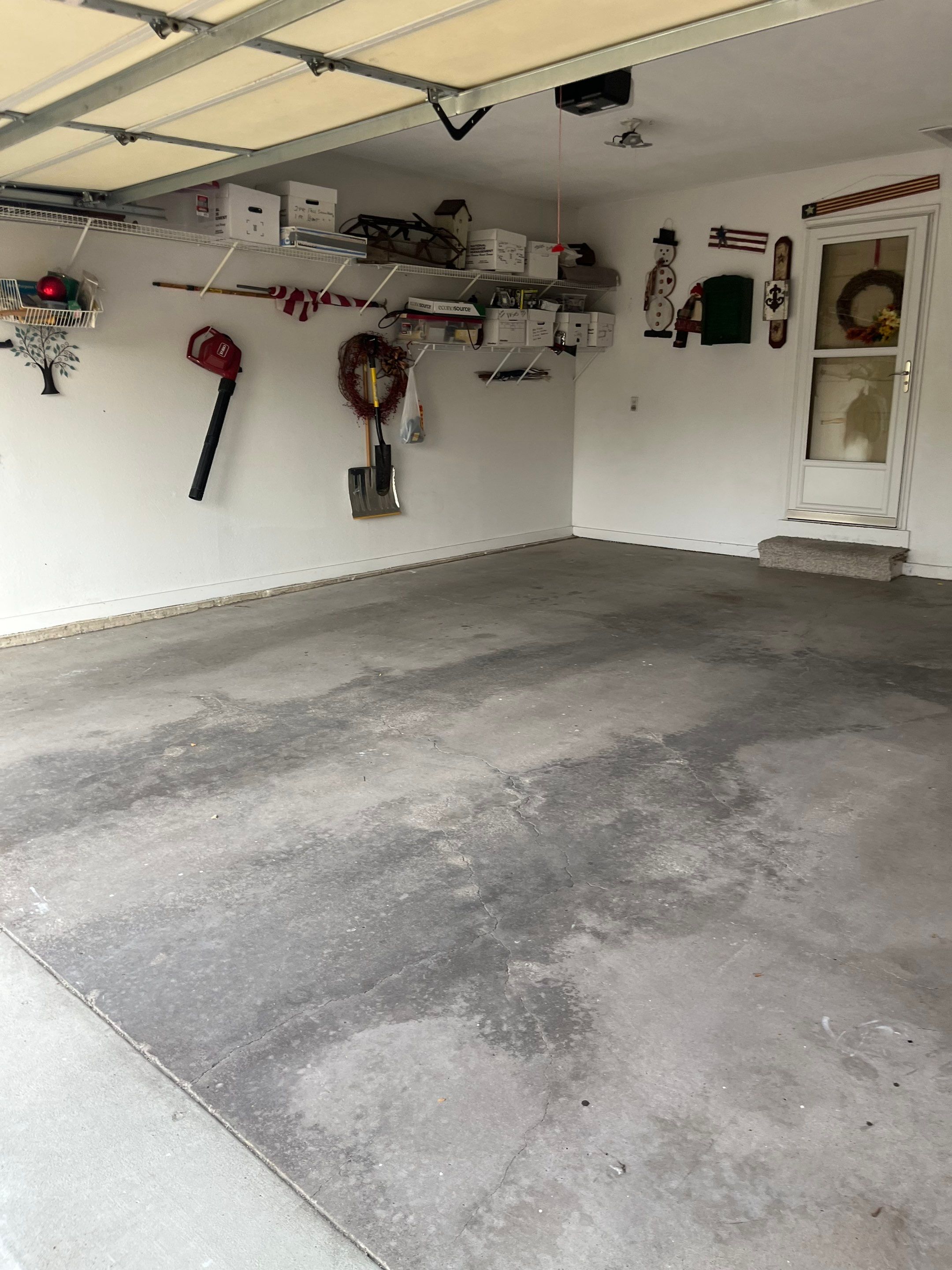 West Des Moines Garage and Patio Floor Coating using Pebble Beach Flakes by Revival Concrete Coatings