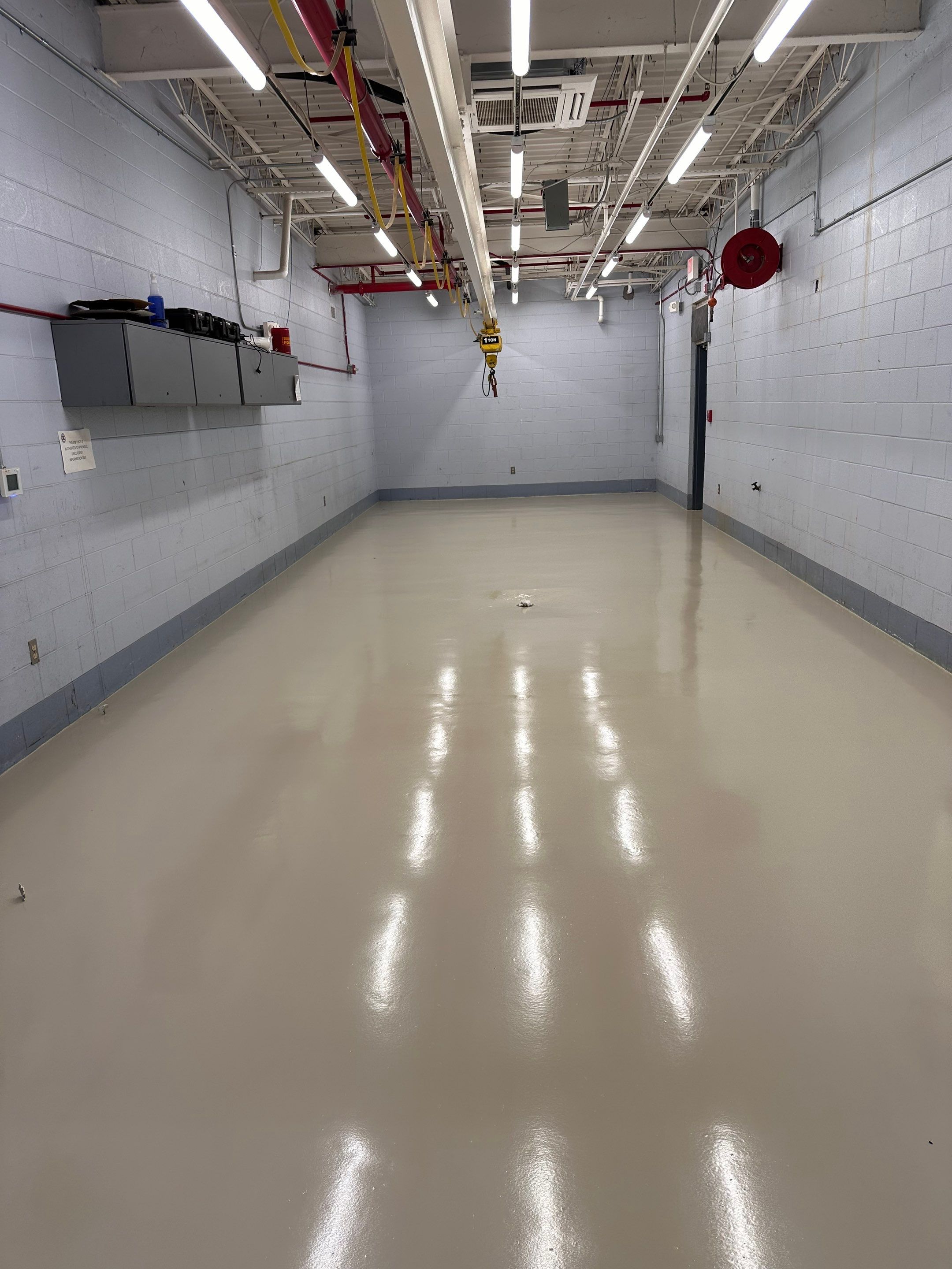 Industrial Epoxy Flooring for Army National Guard Hangar in Mobile by Cornerstone Hard Surface Restoration 
