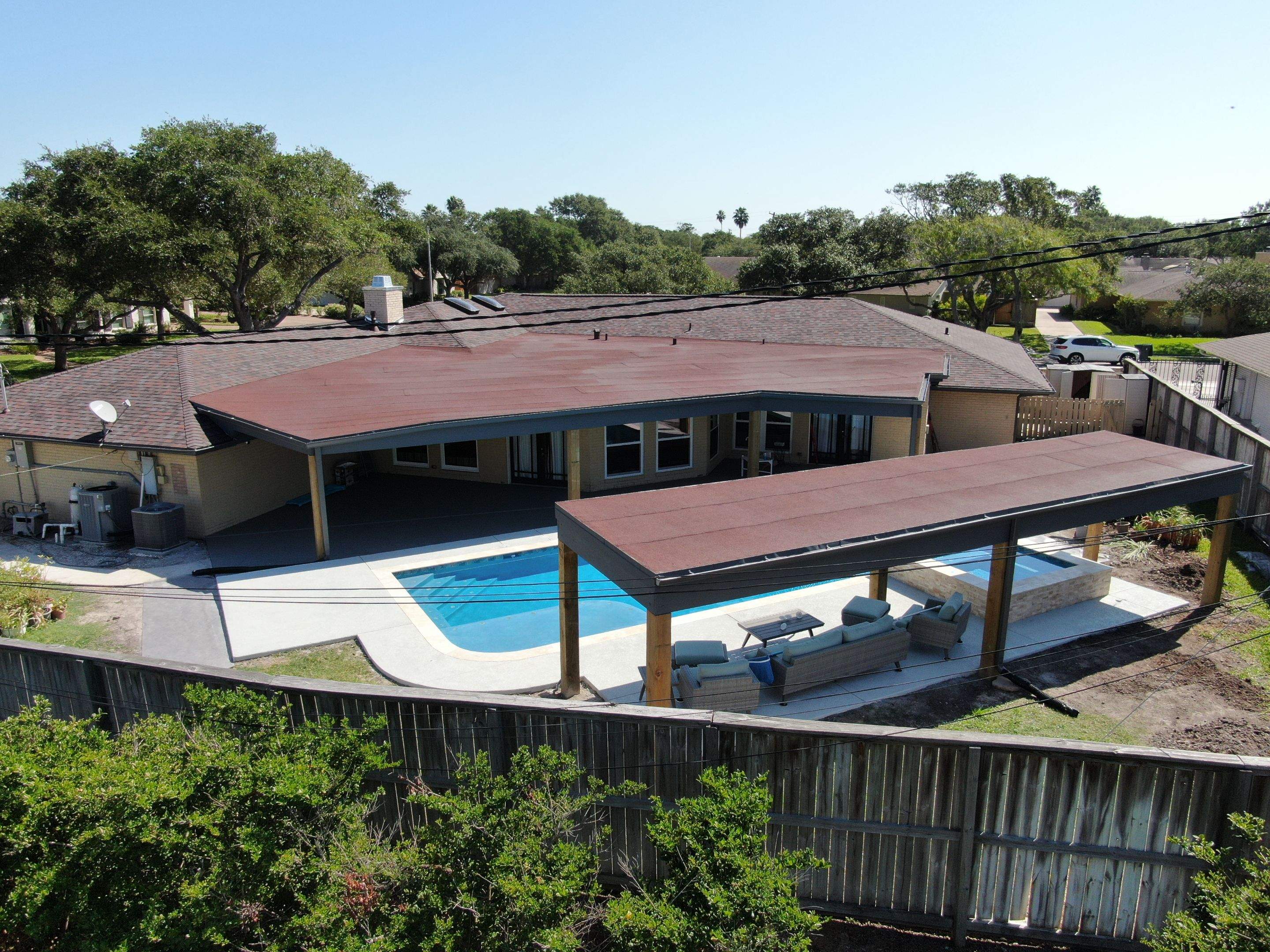 Beautiful pool side build by Bayfront Roofing and Construction