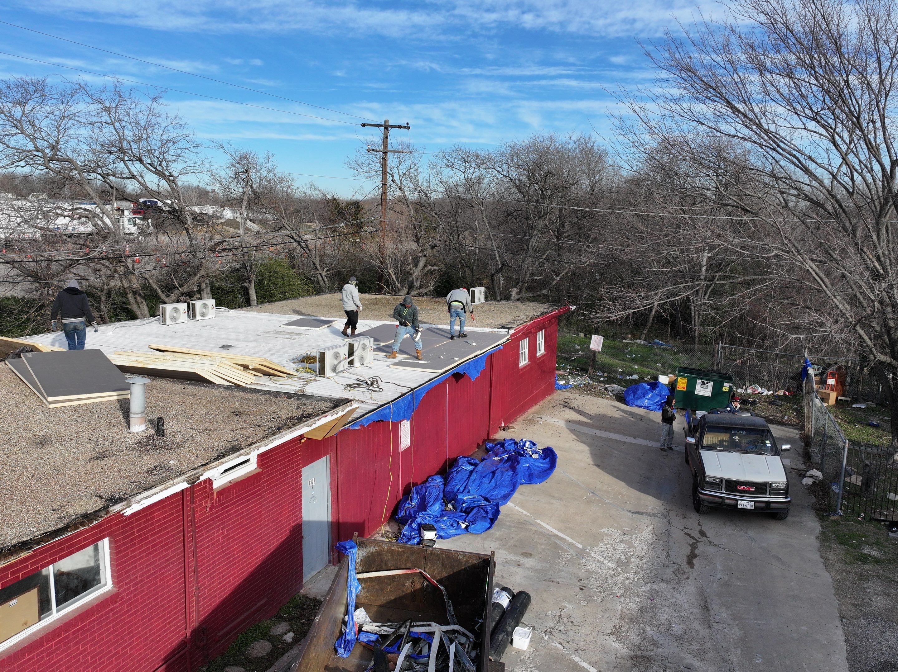 Commercial roofing overlay using GAF TPO over an old ballast roof by Becker Roofing and Exteriors