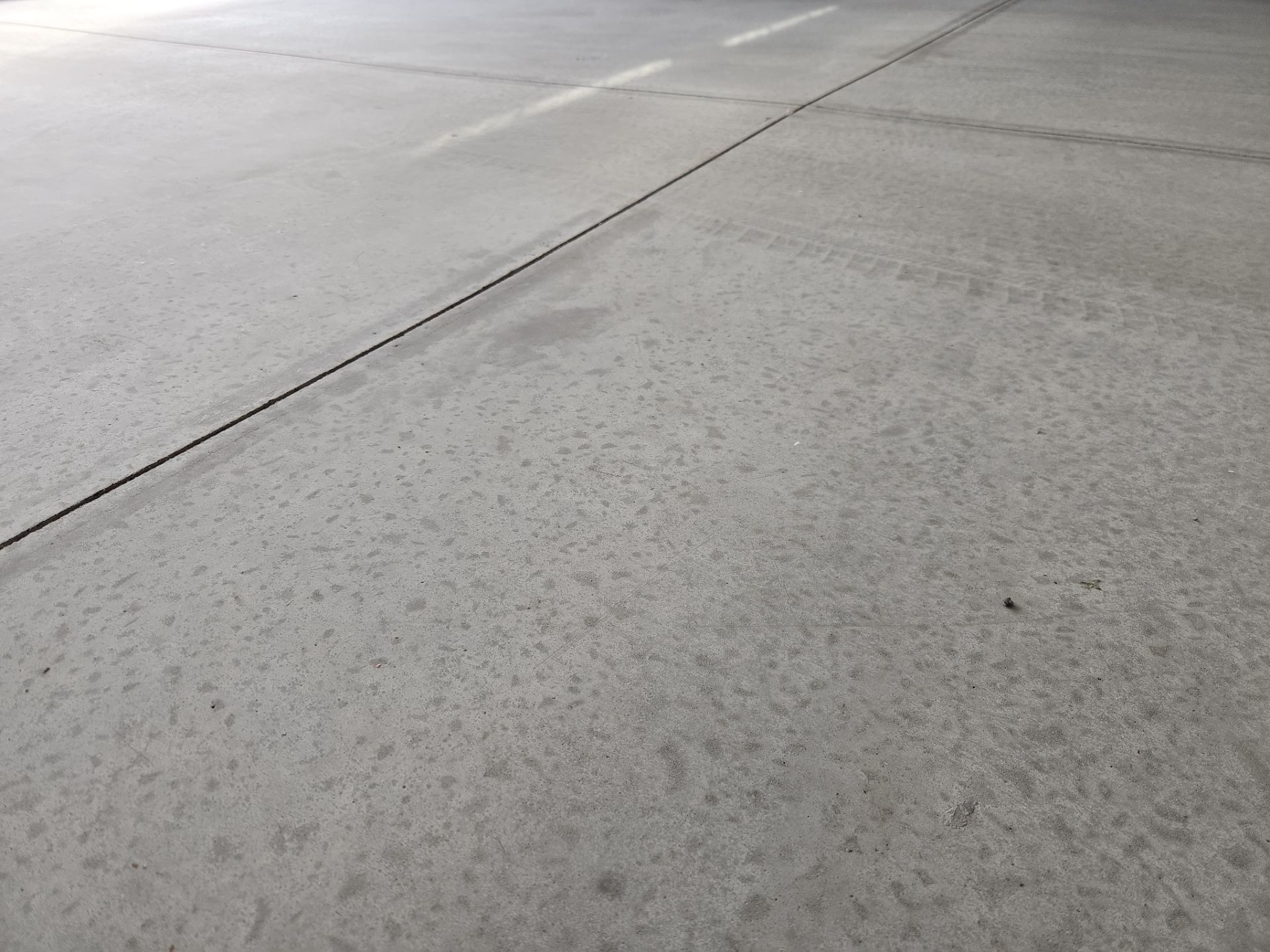 High-Gloss Epoxy Flake Garage Floor Coating in Brandon by Select Painting, Coatings & Garage Cabinets