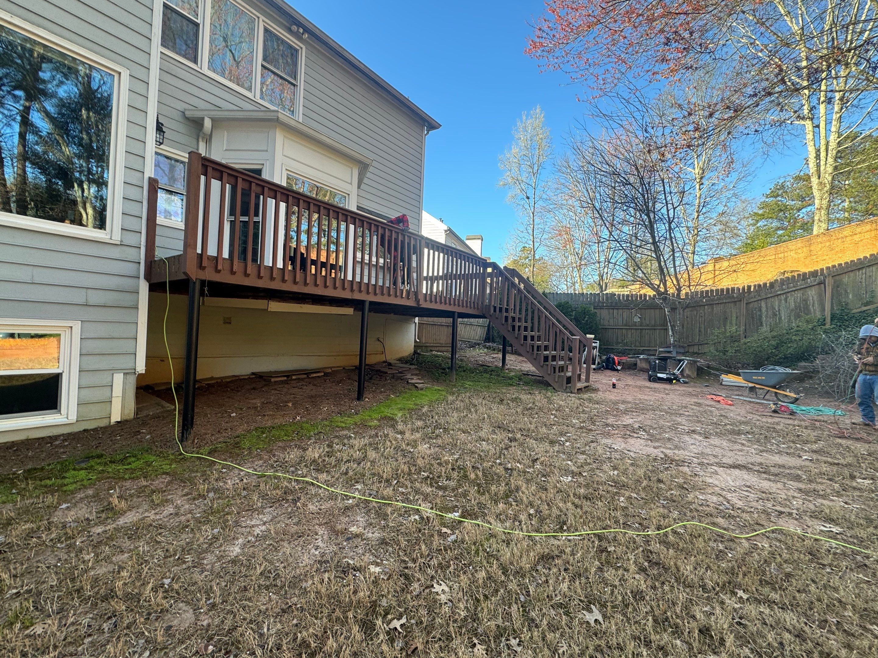 Elevated Deck Replacement with Black Metal Railings in Johns Creek by Swift Home Renovations