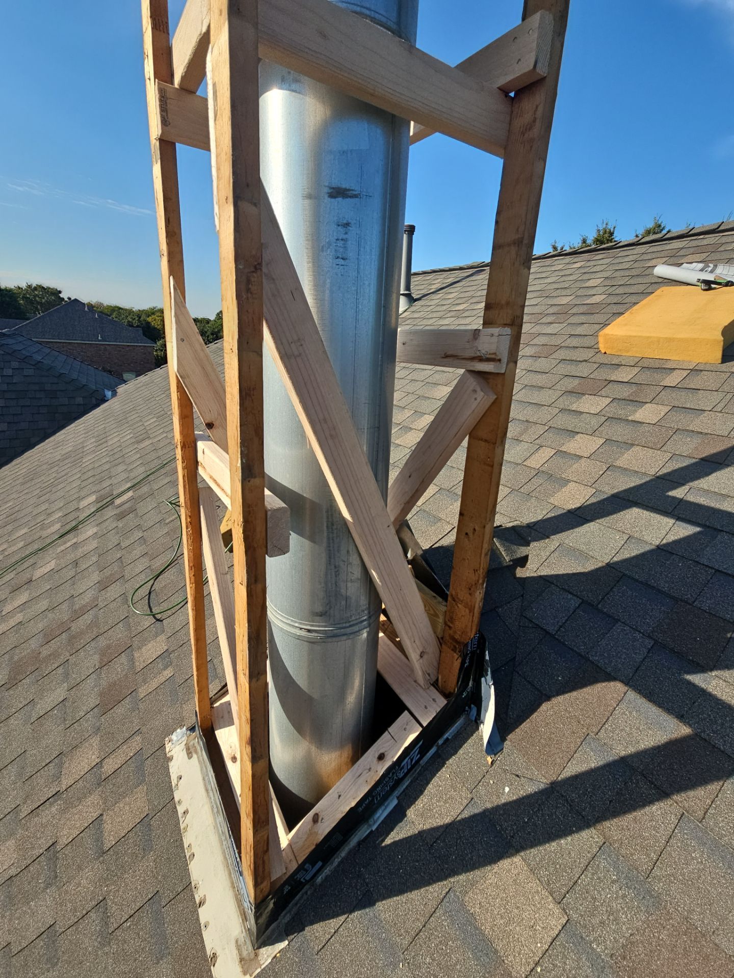 chimney repair using lap engineered treated composite siding. by road roofing llc