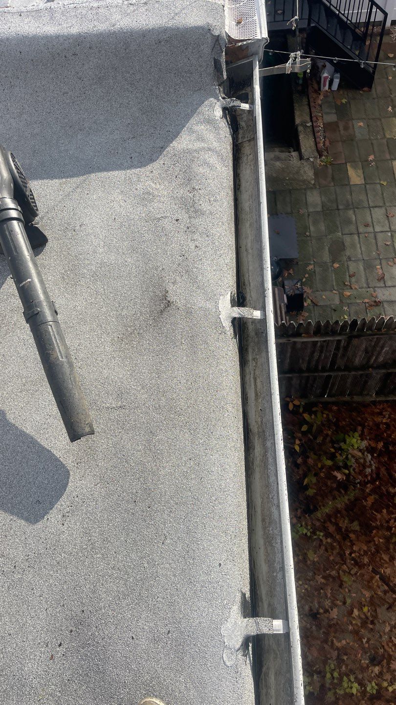 Flat Roof Cleanup and gutter cleaning.  by Above All Gutters 