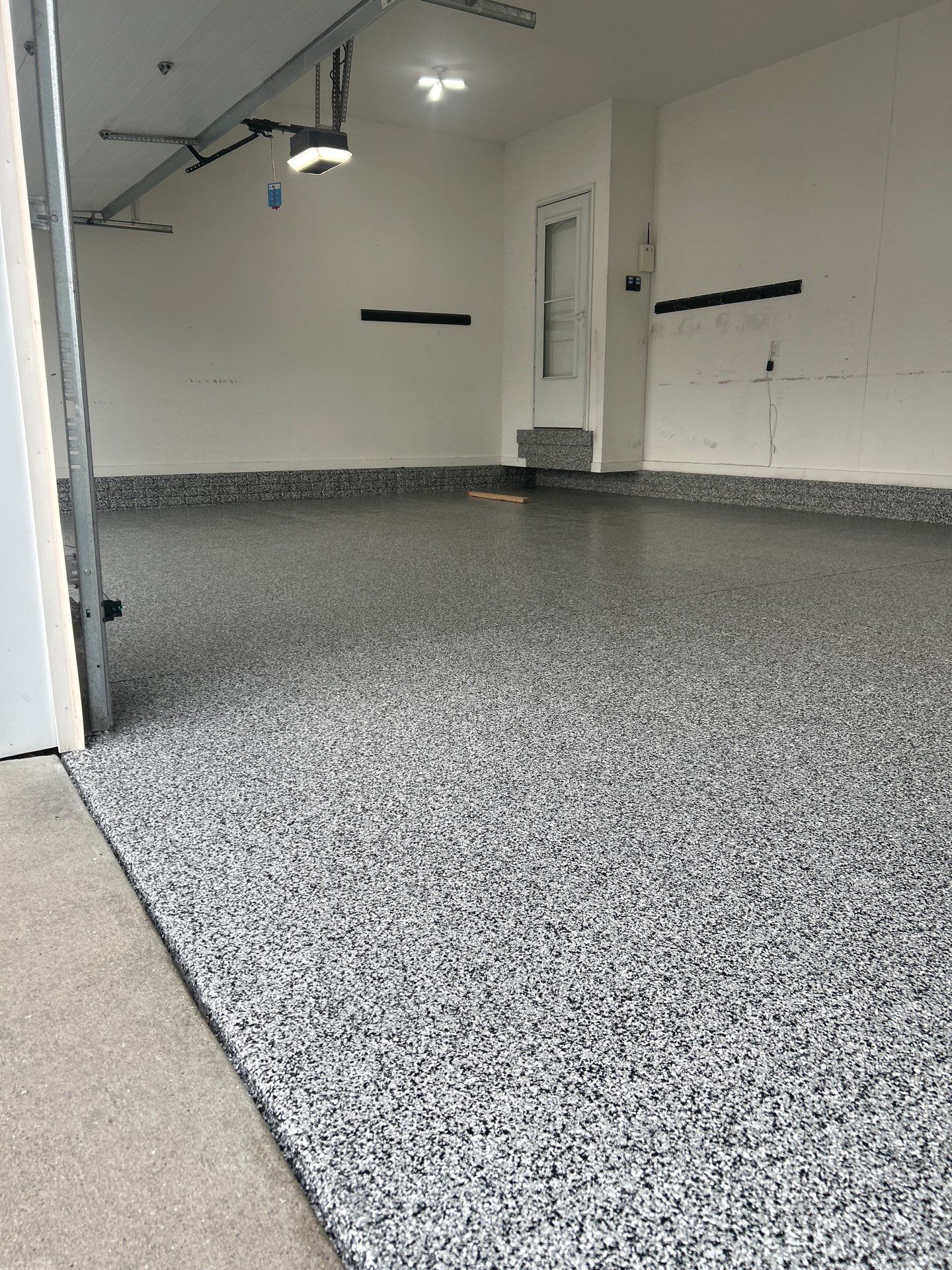 Garage Floor Coating using Domino Flake by Revival Concrete Coatings