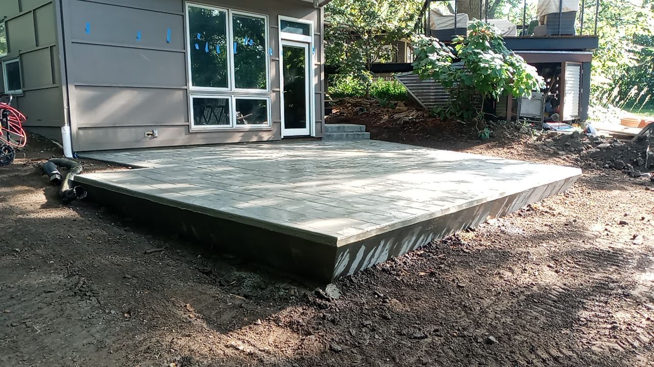 Back Yard Cantilivered Patio by LAND ESCAPES LLC