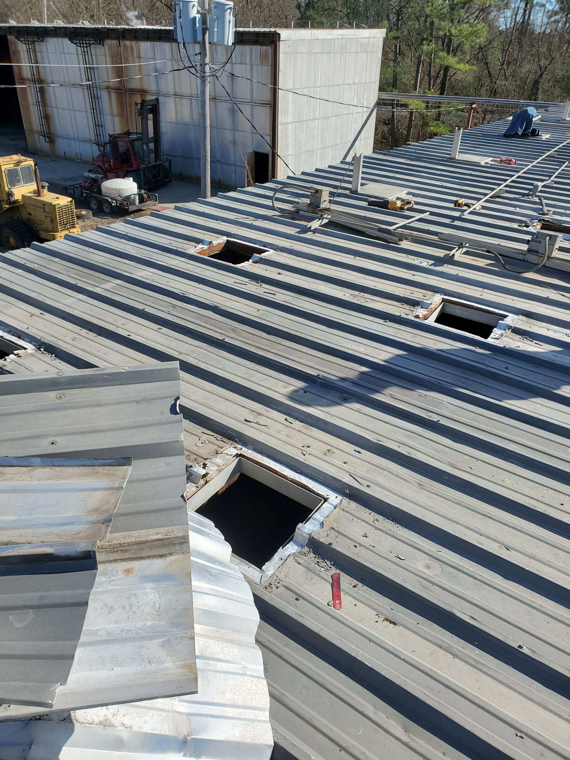 Commercial Roofing Installation using Aluminum Roofing panels by Hostetler Roofing