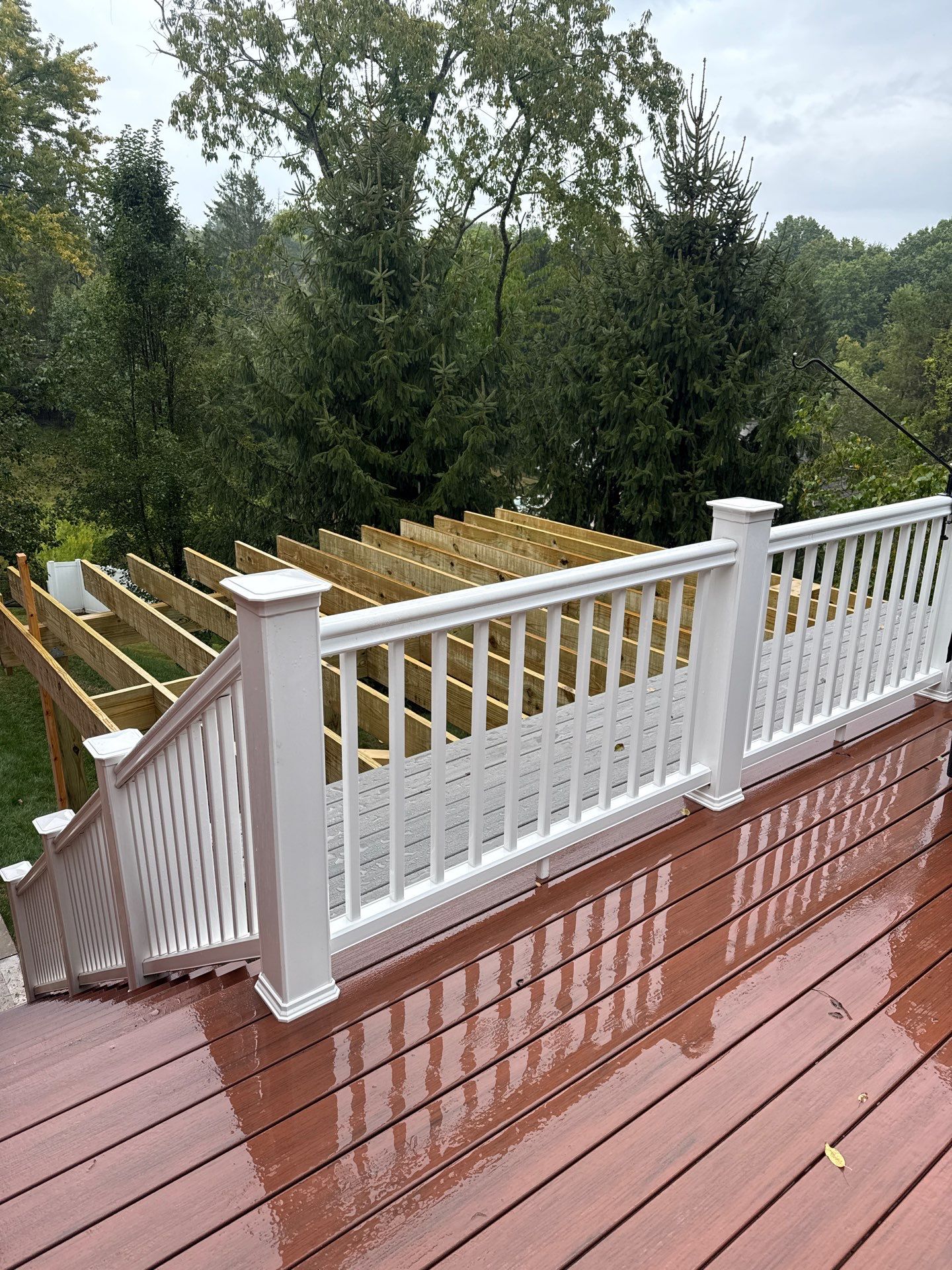 Deck extension  by Cousins Roofing Siding & Decks