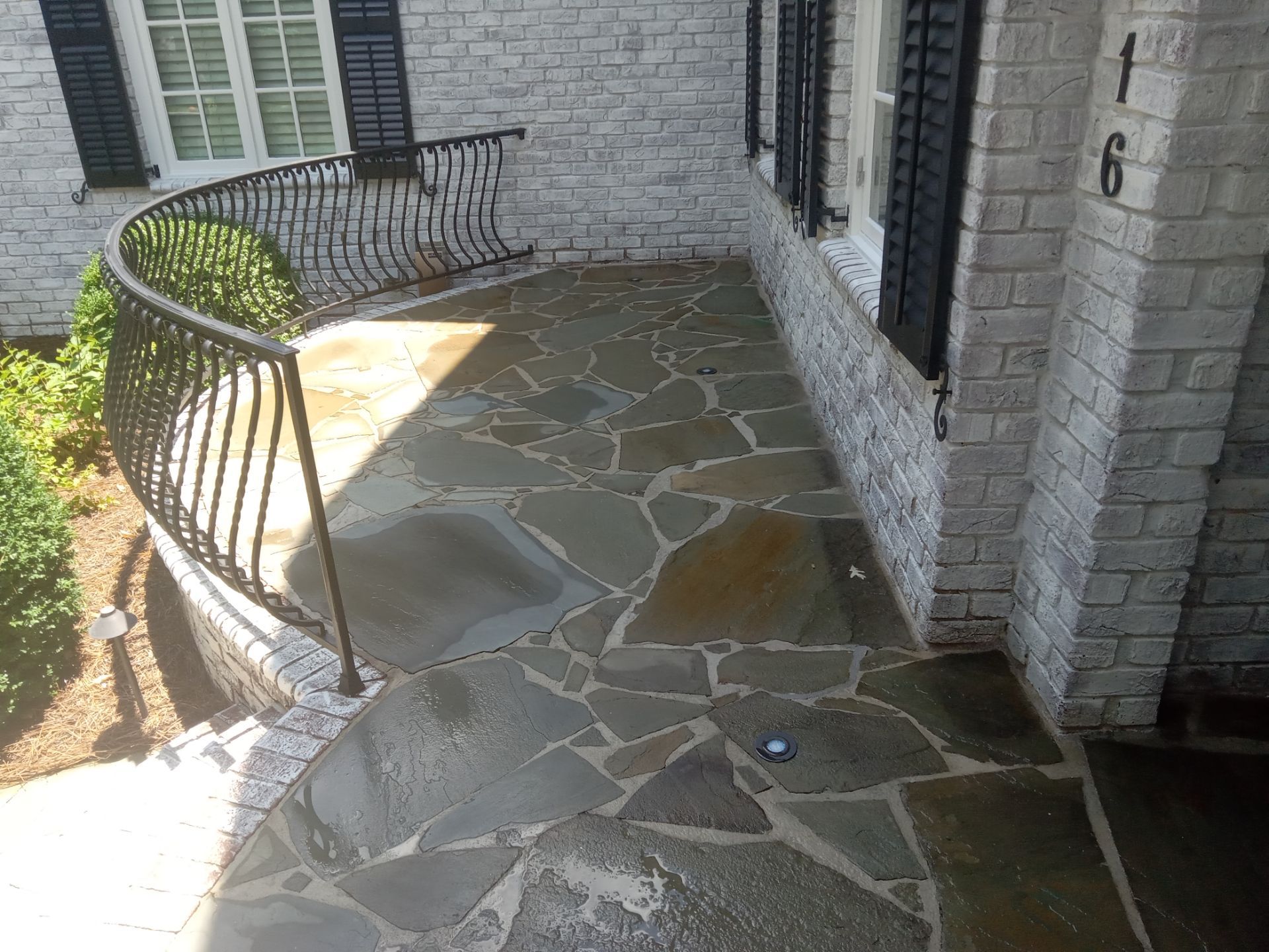 pressure washing flagstone patio removing dirt and stains restoring appearance