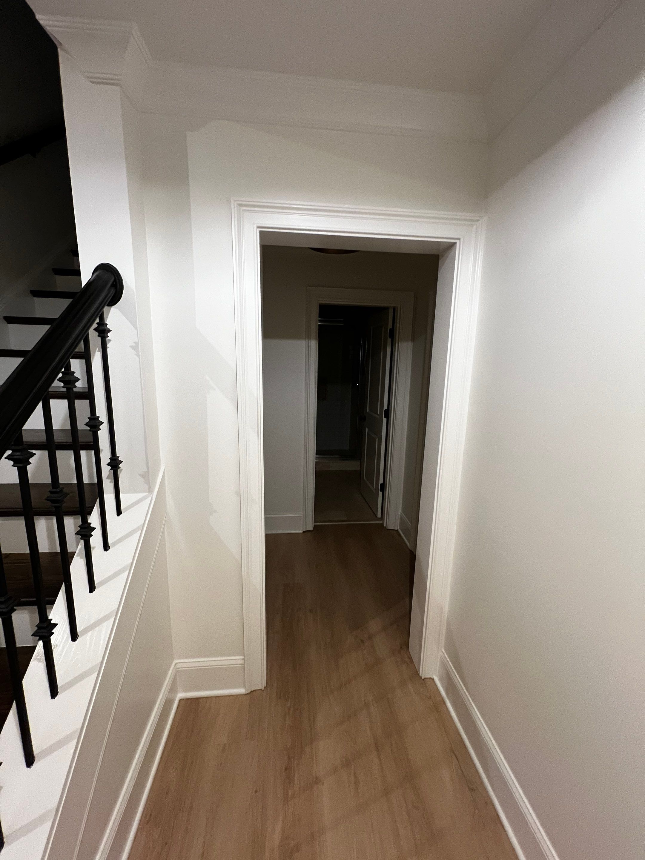Atlanta Basement Refinishing with Wood Laminate Flooring and Interior Painting by Swift Home Renovations