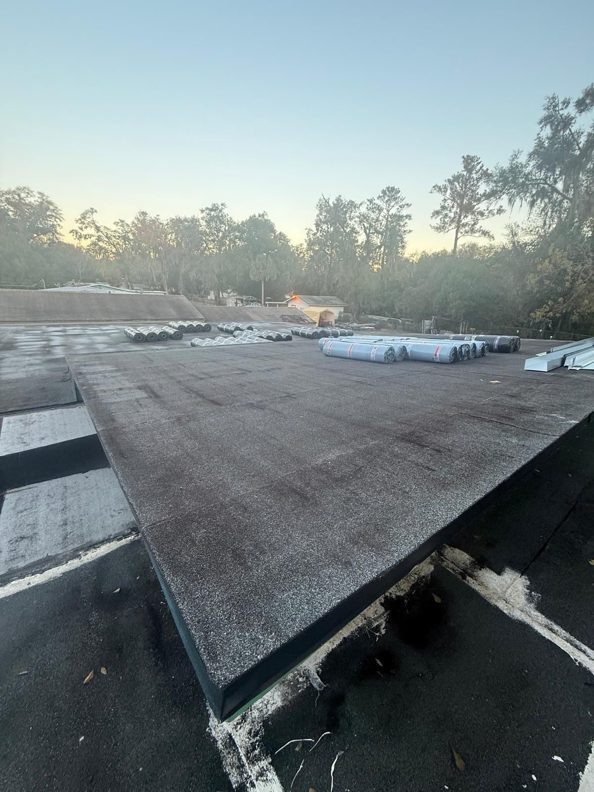 Flat Roof Renovation Due to Water Accumulation by urban green energy llc