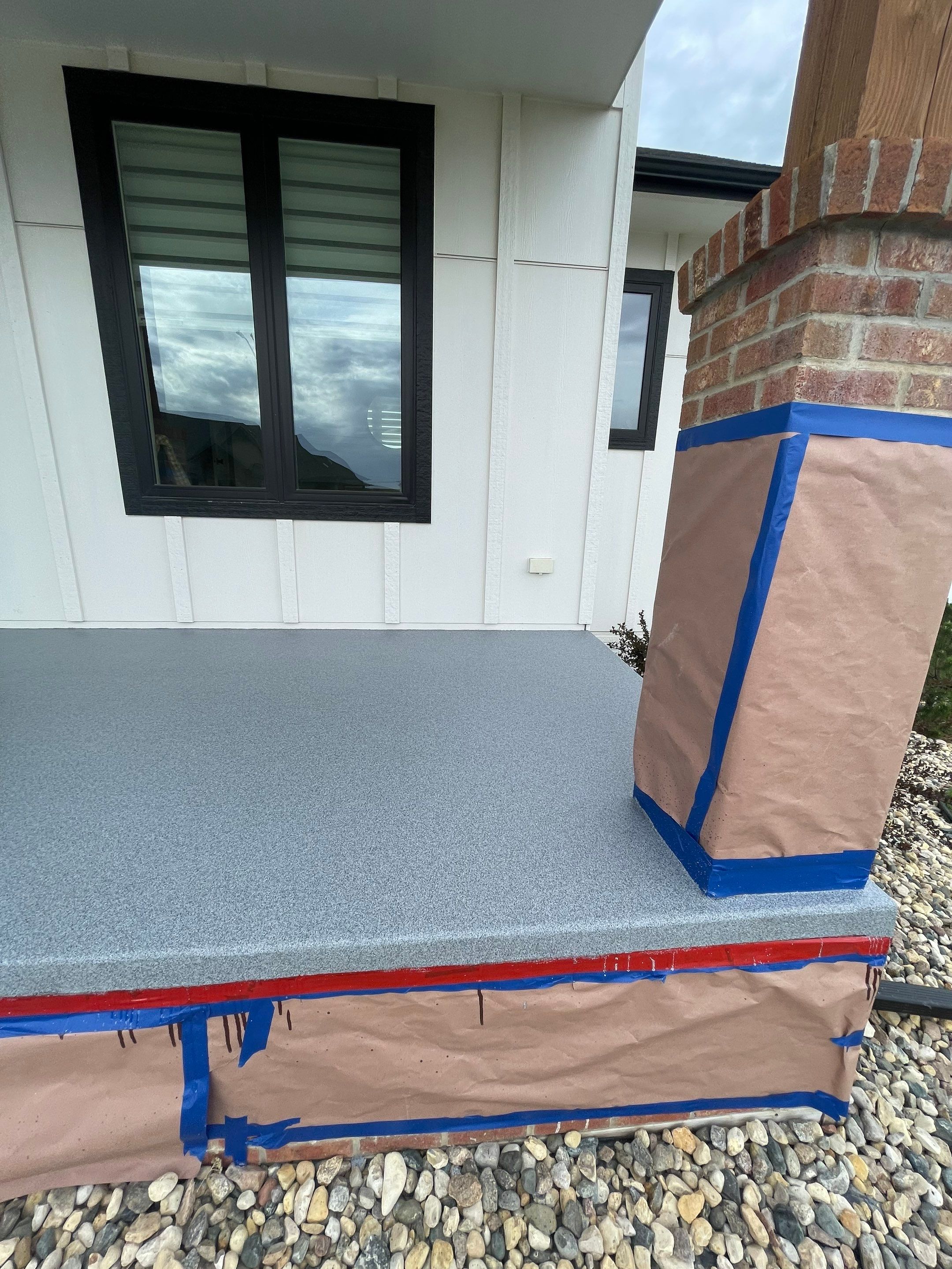 Grey Speckled Concrete Porch Coating for Sioux Falls Home by Select Painting, Coatings & Garage Cabinets