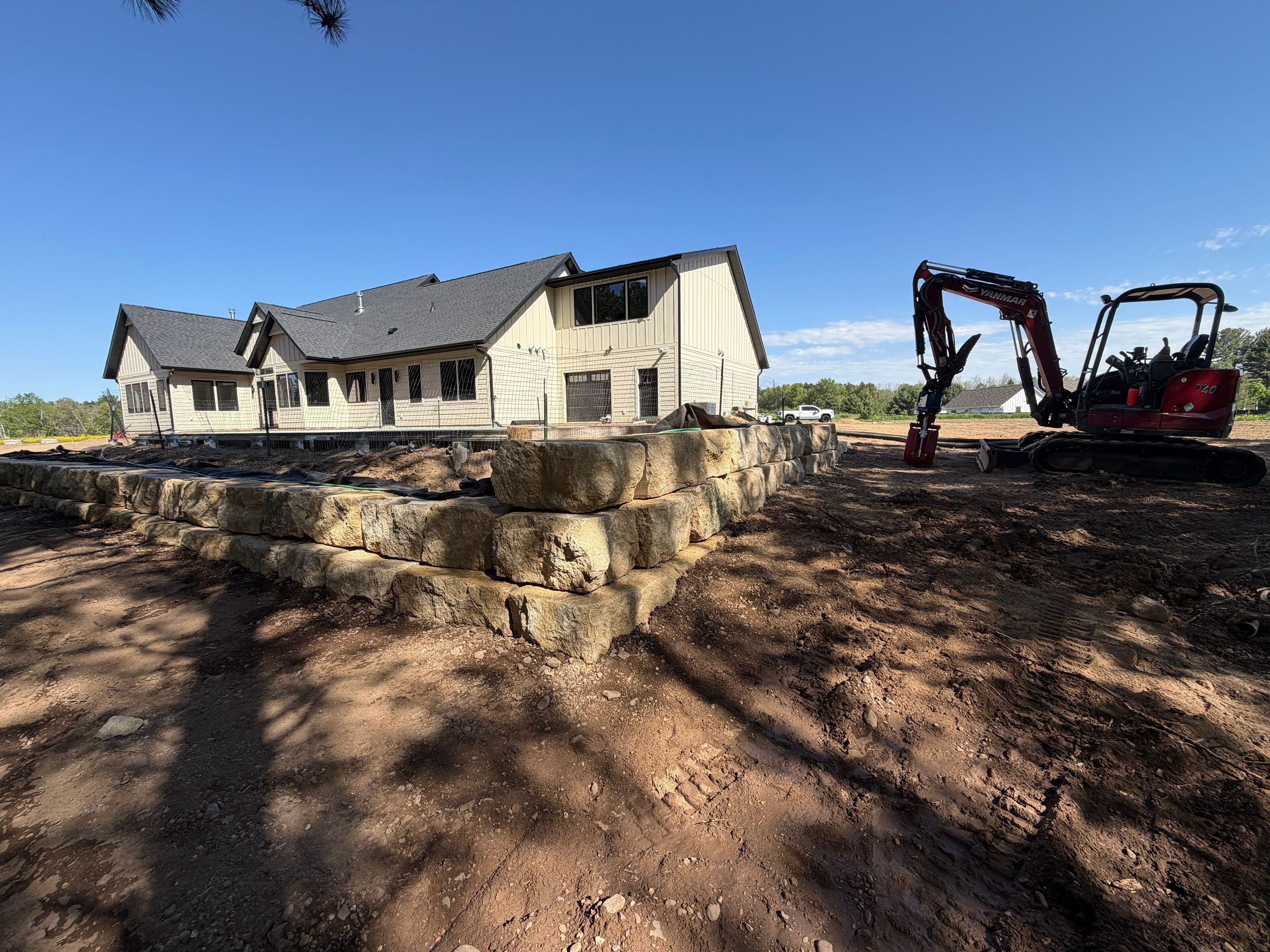 Limestone Boulder Wall by Sota landscaping