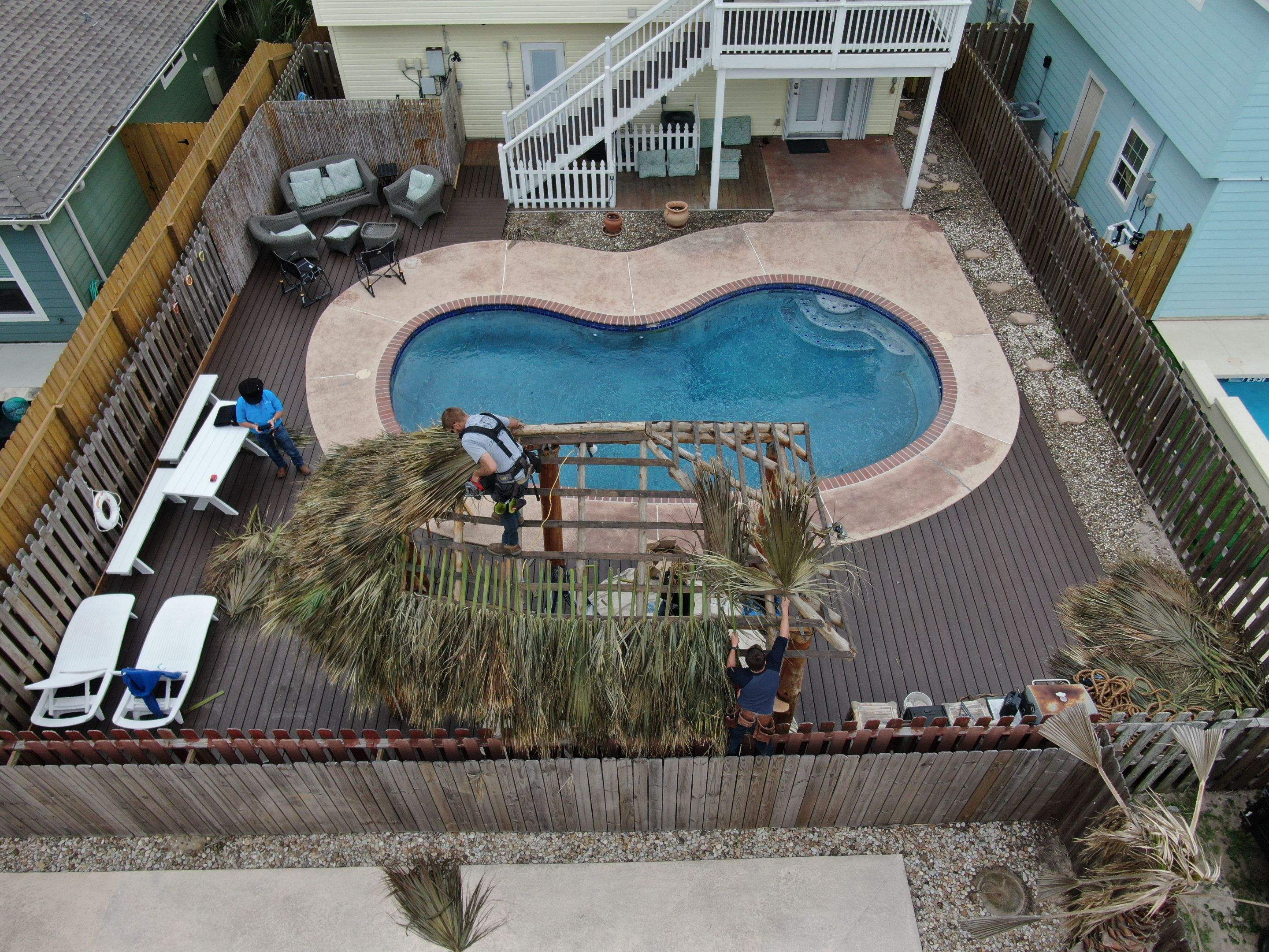 Poolside paradise by Bayfront Roofing and Construction