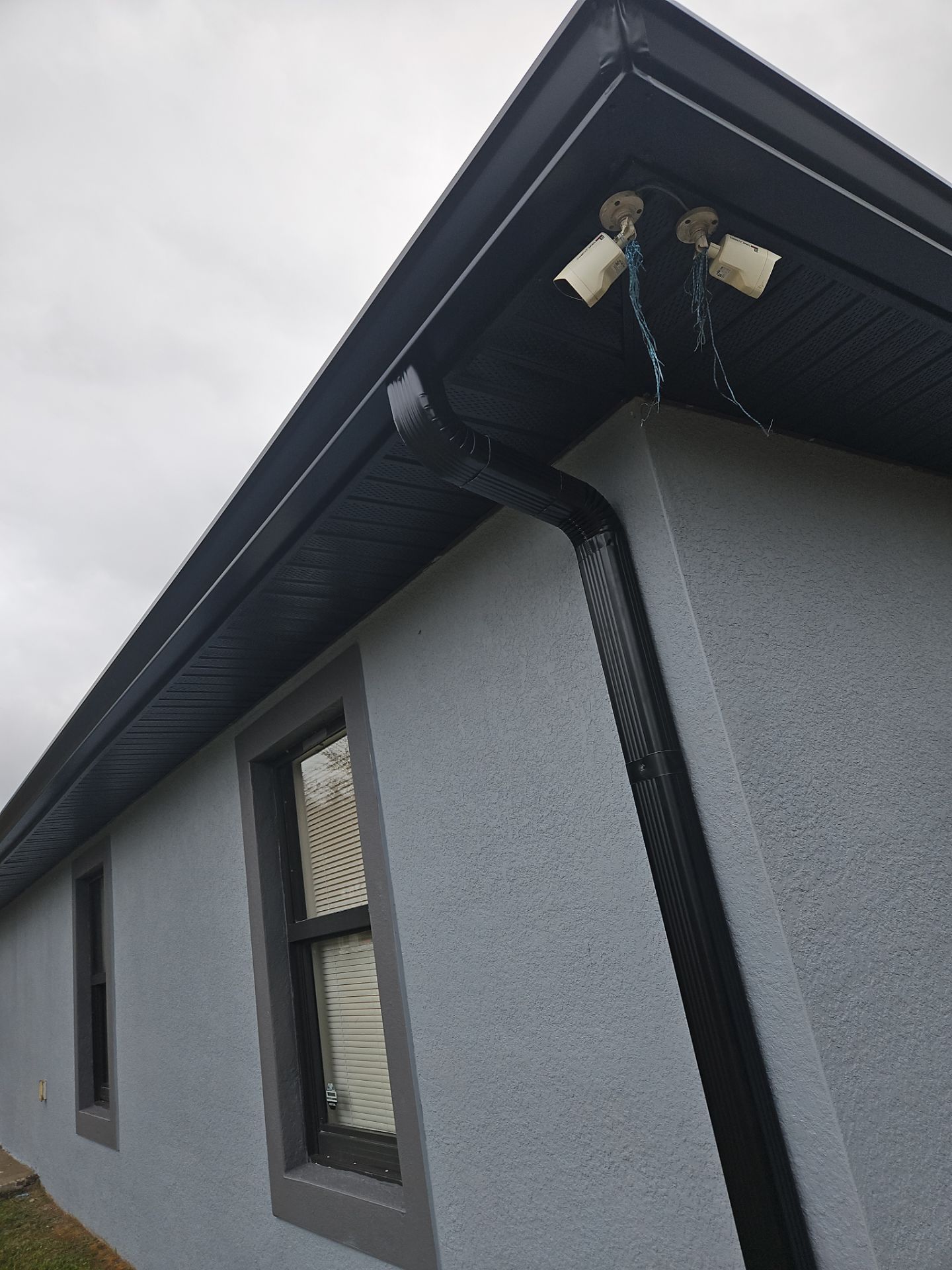 Black Seamless Gutters & Soffit/Fascia in Lehigh Acres FL by Gutter Professors