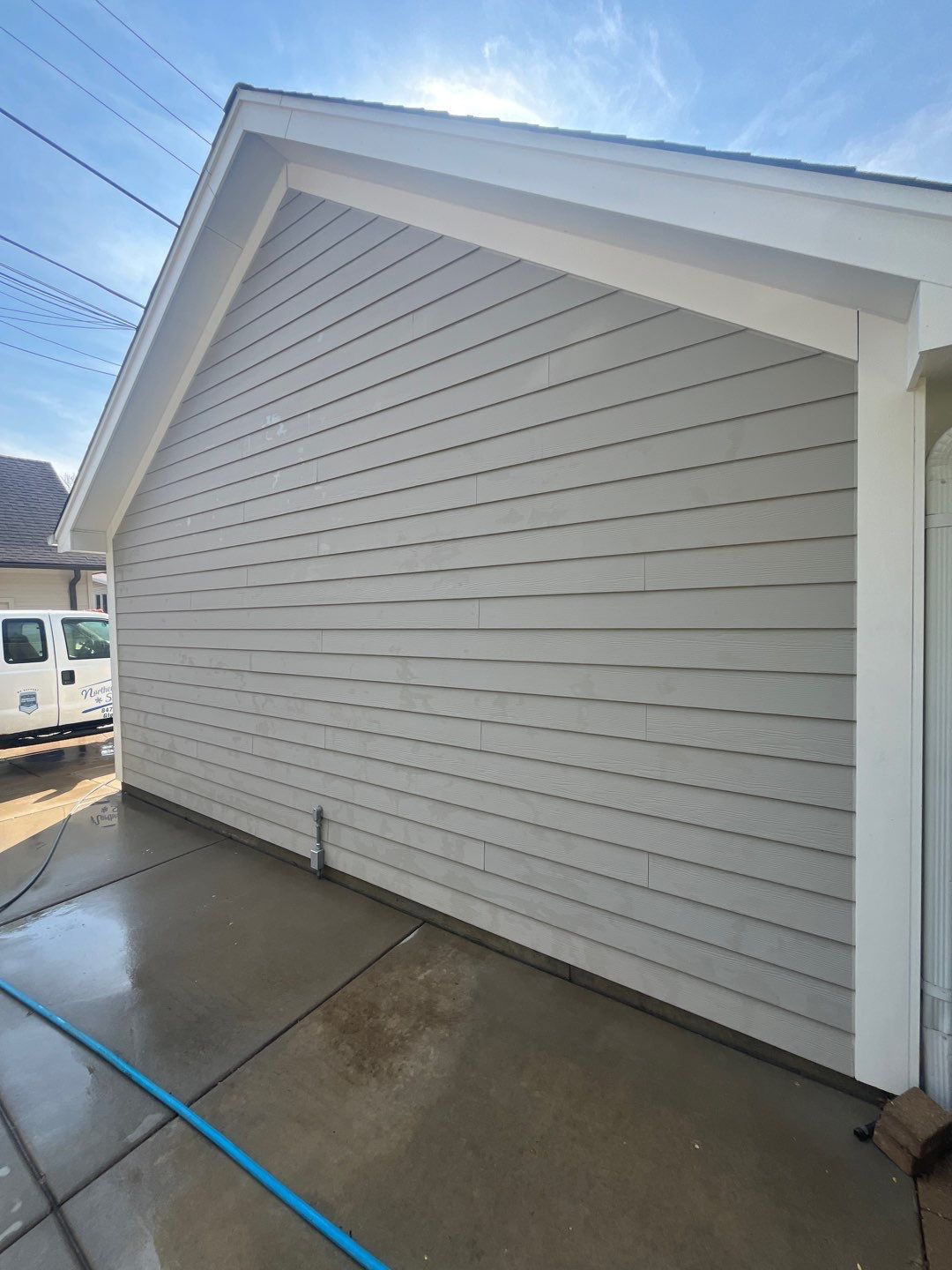 Hardie Board House & Detached Garage Soft Washing by Northern Power Washing LLC.